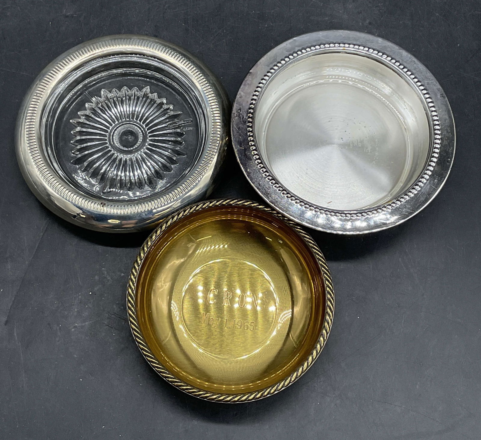 3 Vintage Silver Plate & Gold Tn Metal Coasters: Three Vintage Silver Plate & Gold Tone Metal Coasters / Trinket Dishes. One piece features cut glass, EVANS coaster features an engraving to the obverse which reads CRON MAY 1 1965, and lastly a WS BL