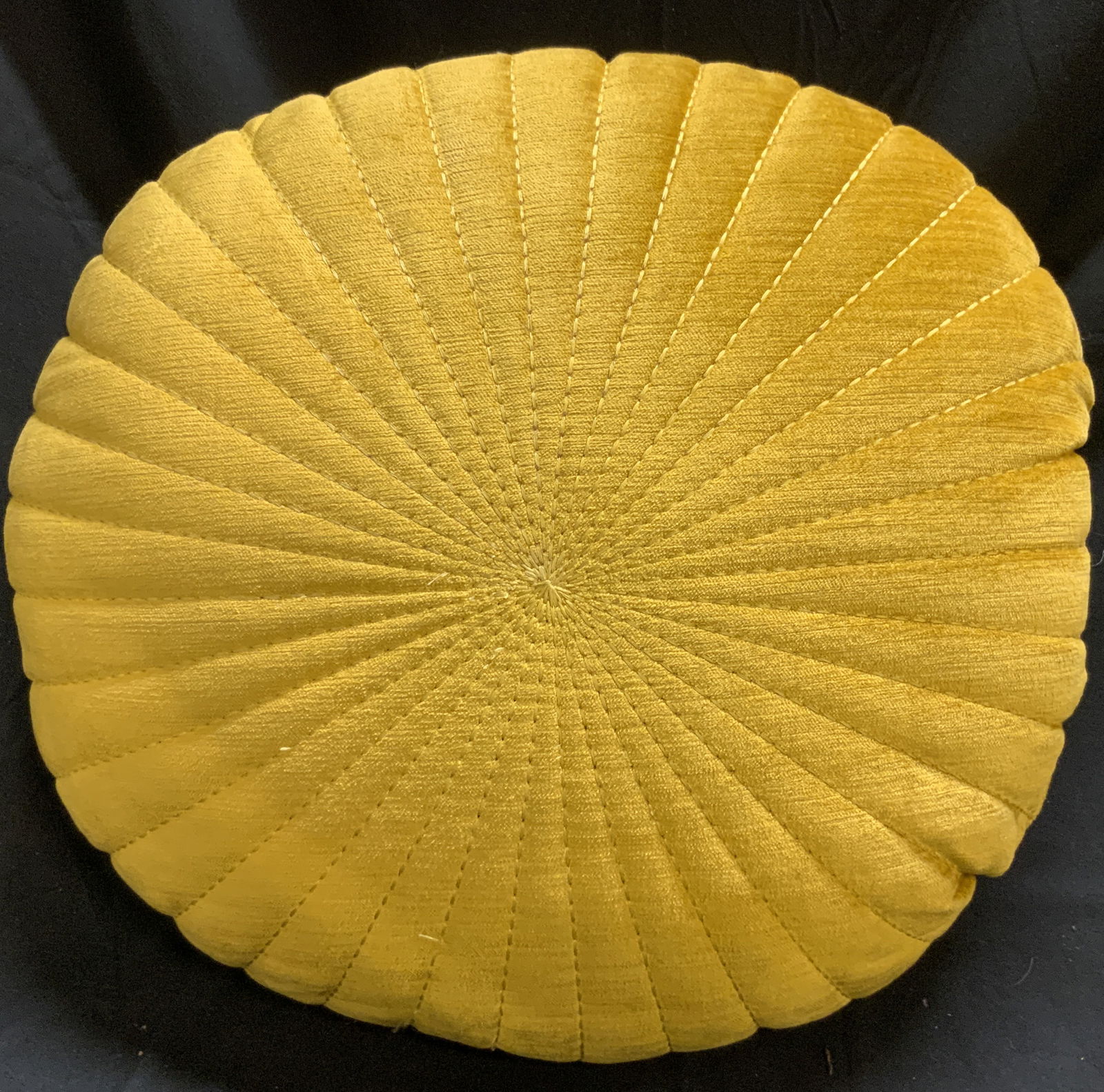 Crushed Velvet Flower Throw Pillow Yellow: Pillow is yellow toned. Piece appears to be crushed velvet possibly cotton. Pillow has Floral form with stitch detail to create floral petal form. Piece measures approximately 16 inches diameter 5.5 i