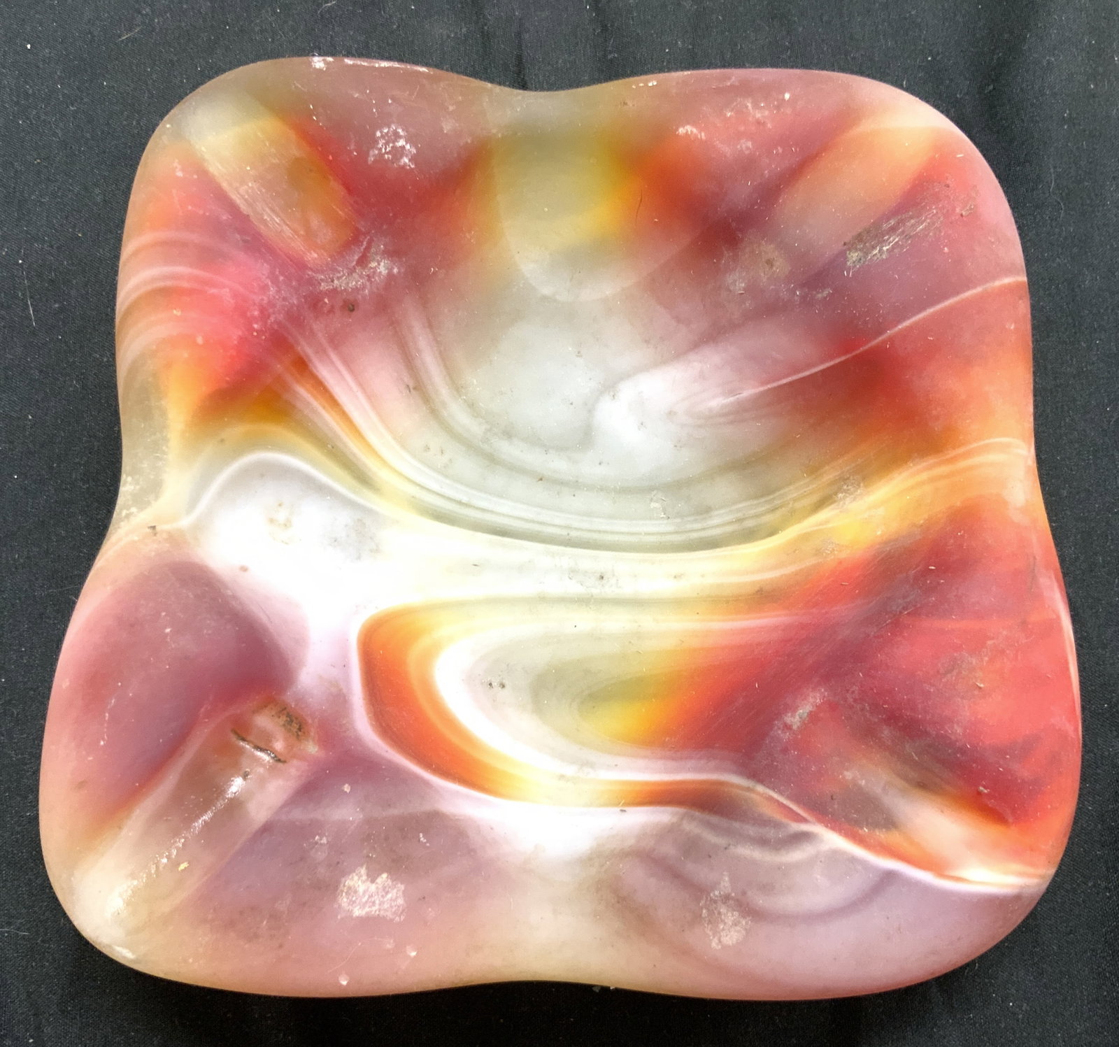Vintage Art Glass Trinket Dish Vessel: Trinket dish is vintage. Piece is thick walled glass with multiple tones. Dimples in corners to utilize as ash tray. Piece is frosted. Measures approximately 6 inches square 1.75 inches tall. Dish, ve