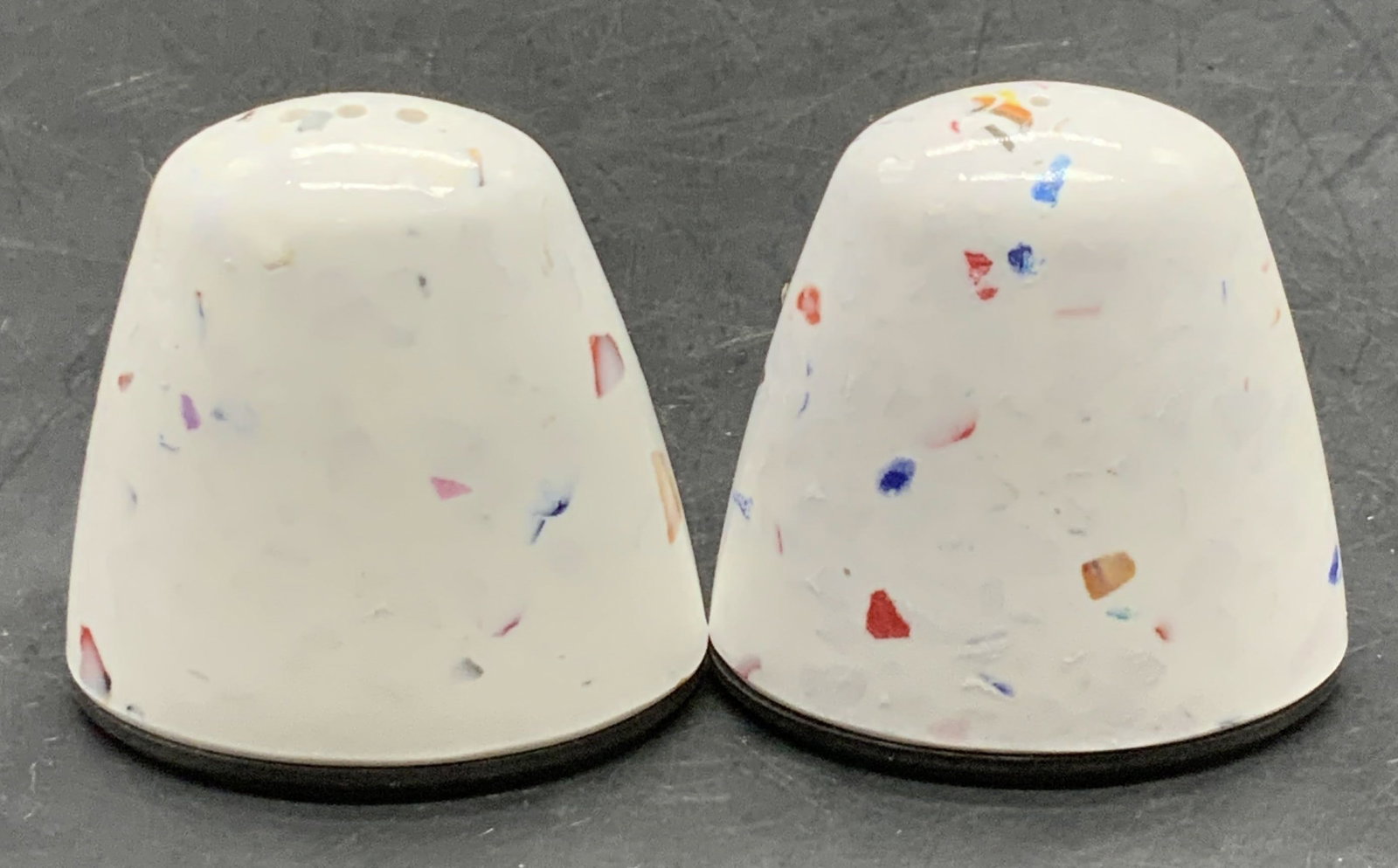 Pair 2006 ZAK! DESIGNS Salt & Pepper Shakers: Pair 2006 ZAK! DESIGNS Salt & Pepper Shakers. Crafted from hard plastic and rubber materials. Confetti inspired design. Rounded form. Underside reads 2006 ZAK! DESIGNS. Measures approx. 2L x 2W in. Re