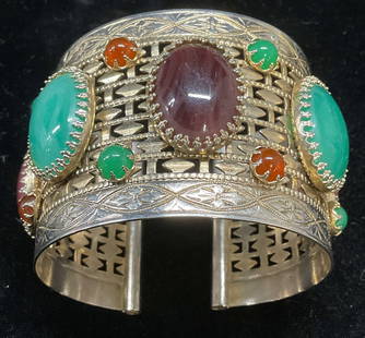 Vintage Silver Tn Faux Cabochon Cuff Bracelet: Vintage silver tone pierced wide band cuff bracelet with multicolor faux stone cabochons. Measures approx 2.5 inches wide, band approx 2 inches wide. Some wear including scratching observed. Jewelry,