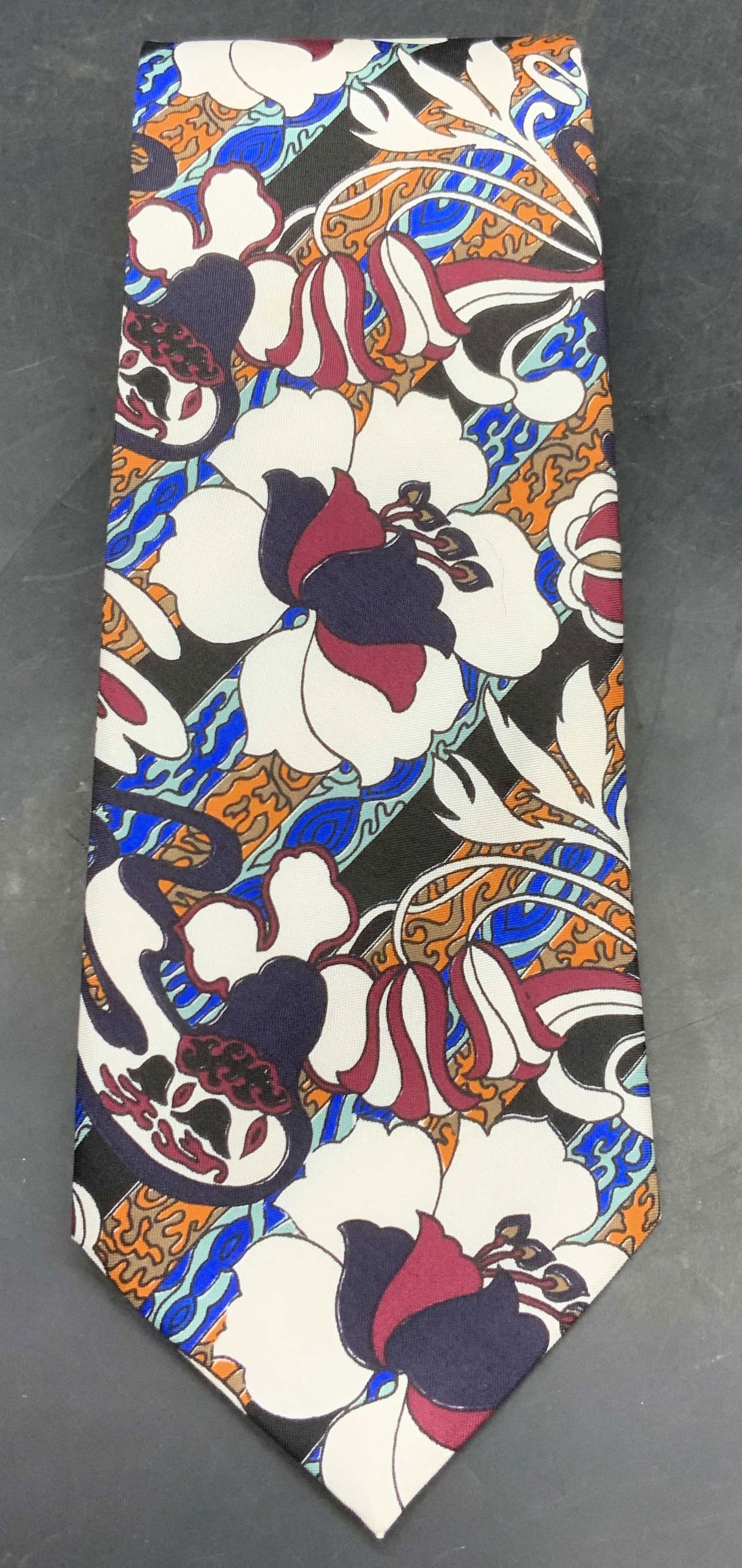 CHANNITI Thai Silk Floral Pattern Tie: CHANNITI Thai Silk Floral Pattern Tie. Tag reads CHANNITI, THAI SILK 100%. Measures approx. 3.5W x 58L in. Surface wear consistent with age, use, and exposure. Ties, wearables, fashion, neckwear, oute
