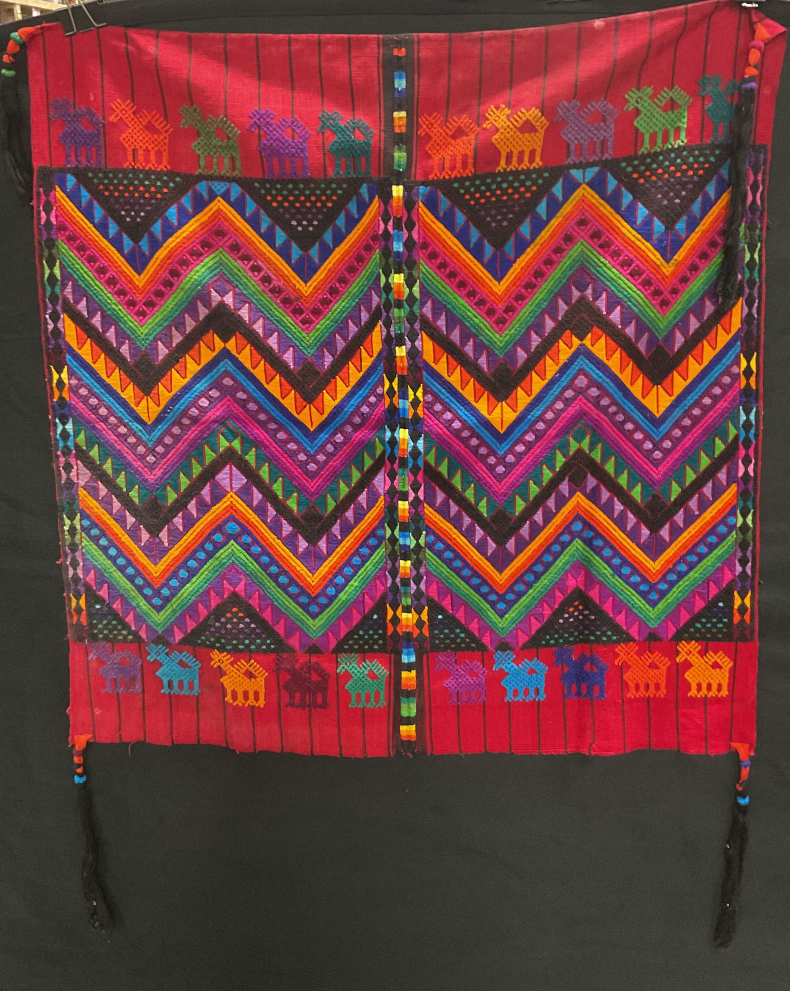 Vtg Guatemalan Colorful Traditional Textile: Vintage Guatemalan colorful traditional textile. Various colors and chevron camels pattern. Woven textile. 33 x 36 inches. Some surface wear consistent with exposure, loose thread observed. Textiles,