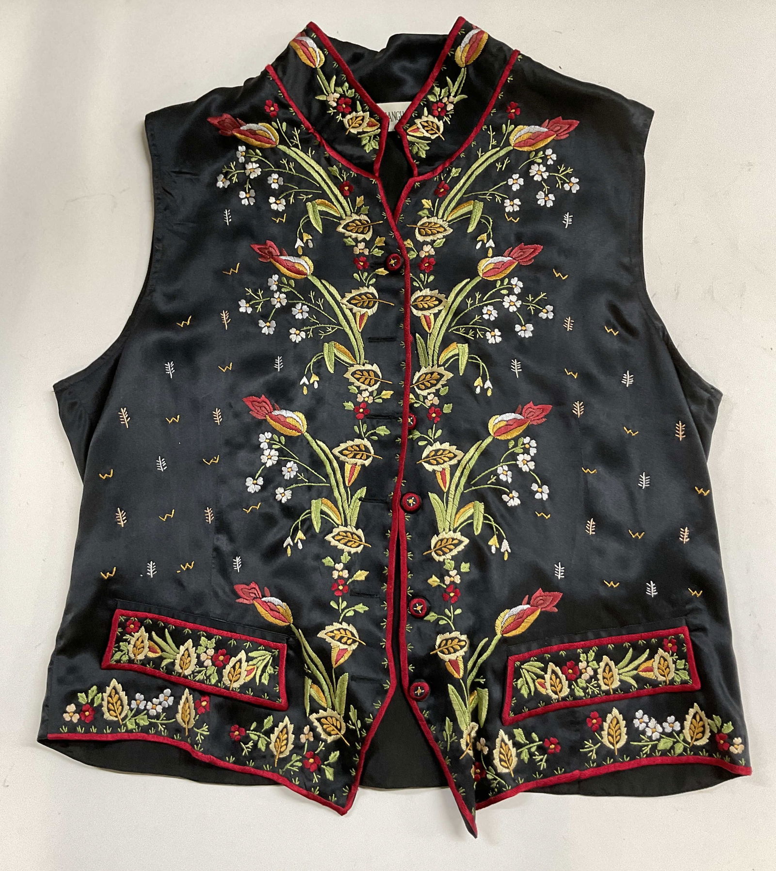 Vtg Shanghai Museum Silk Black Floral Vest: Vintage Shanghai Museum silk black floral vest. Front button down vest. Embroidered floral designs. Fully lined. Backside ribbon included. 100% silk. Size L. Some surface wear consistent with exposure