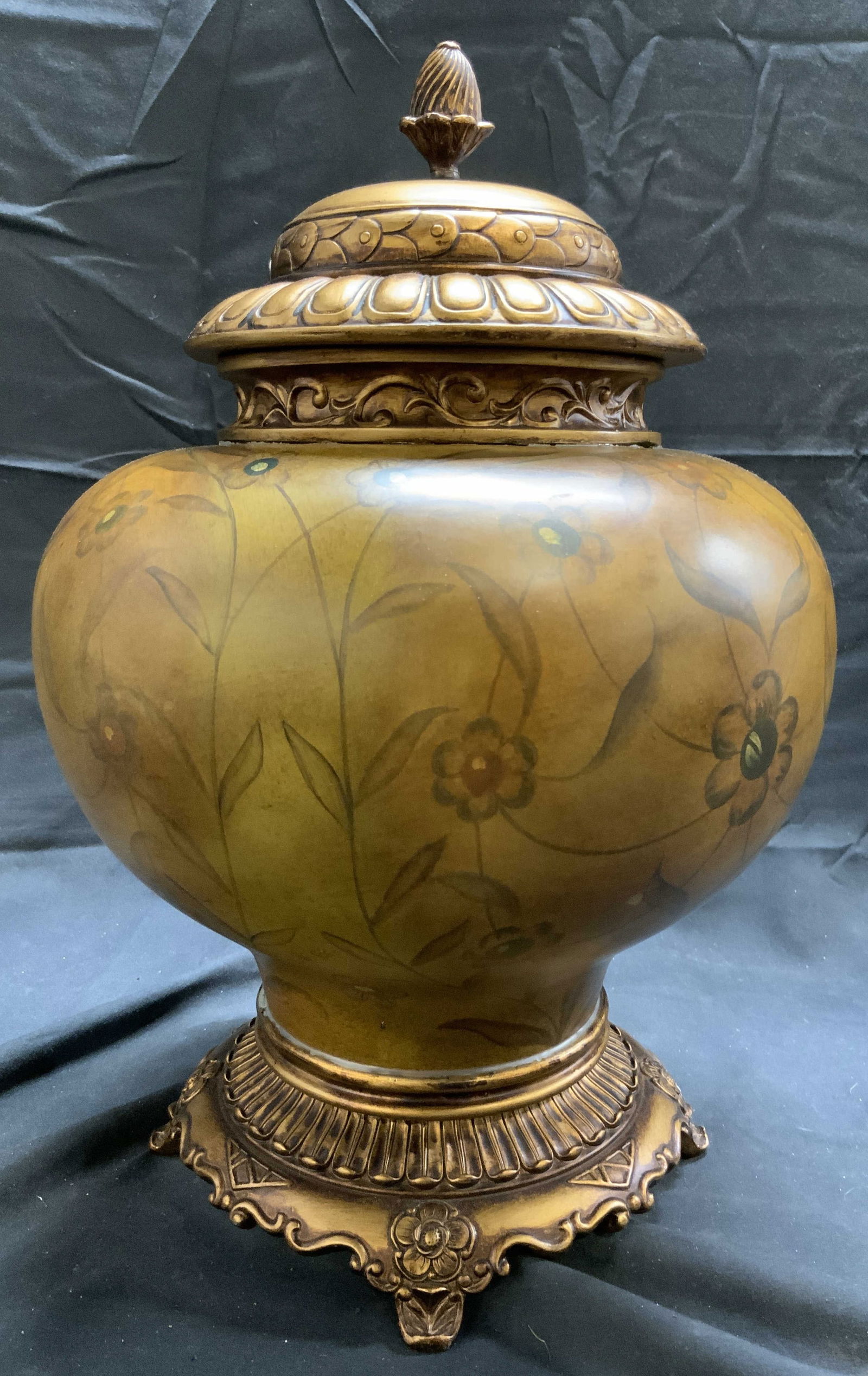 Composite Floral Urn W Lid & Feet 14.25in H: Urn appears to be composite. Piece has floral, vine and leaf detail. Urn includes lid. Piece has 4 ornate feet. Urn measures approx 14.25 inches tall 9 inches wide. Urn, urn with lid, composite urn, f