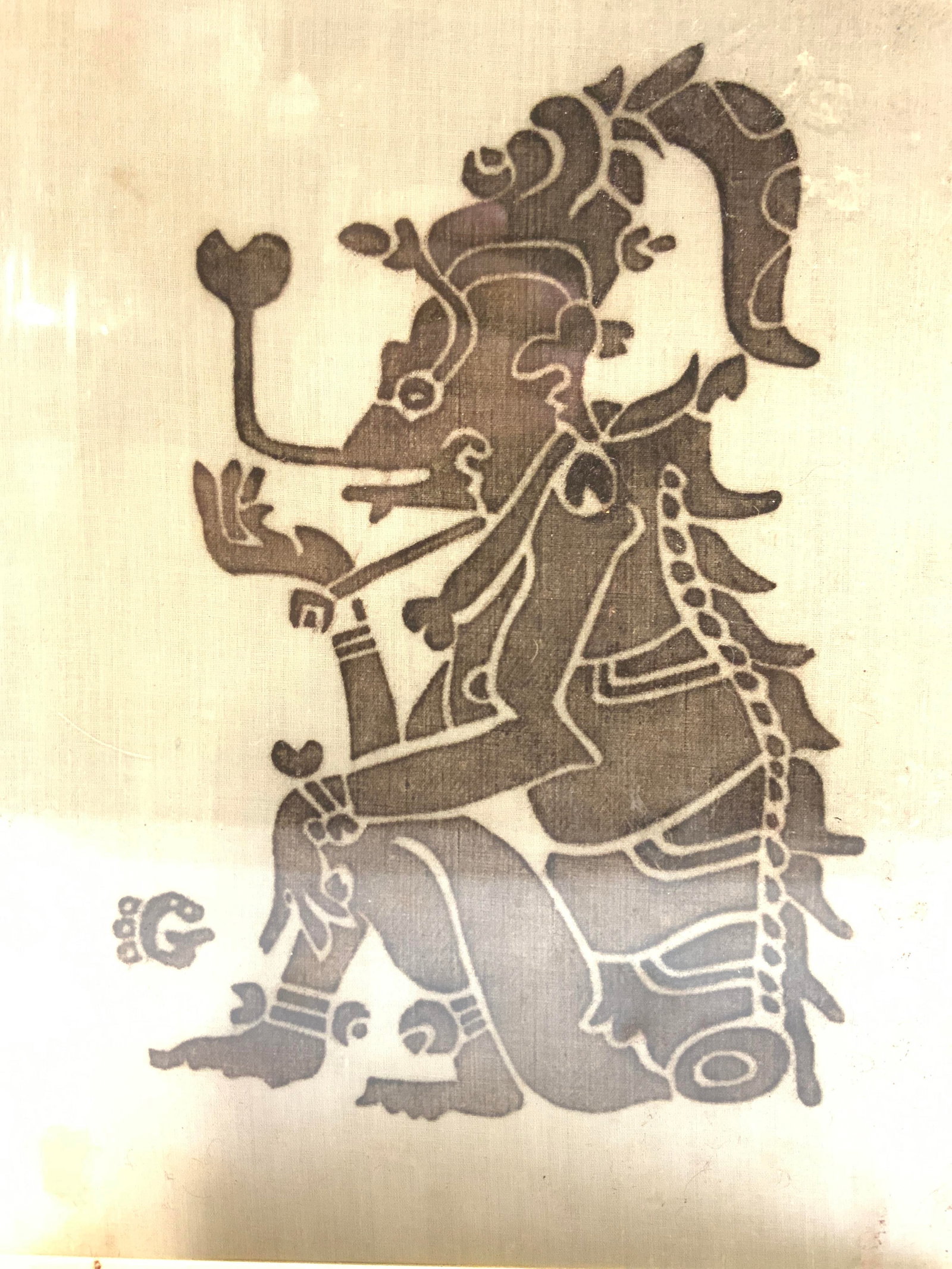 Vintage Mayan Rubbing Of Seated Tribal Figure: Vintage rubbing of tribal figural. Piece is on tan toned cloth encased in acrylic. Figure is brown toned. Piece measures approximately 10 inches tall 8.25 inches wide. Art, Mayan rubbing, tribal figur