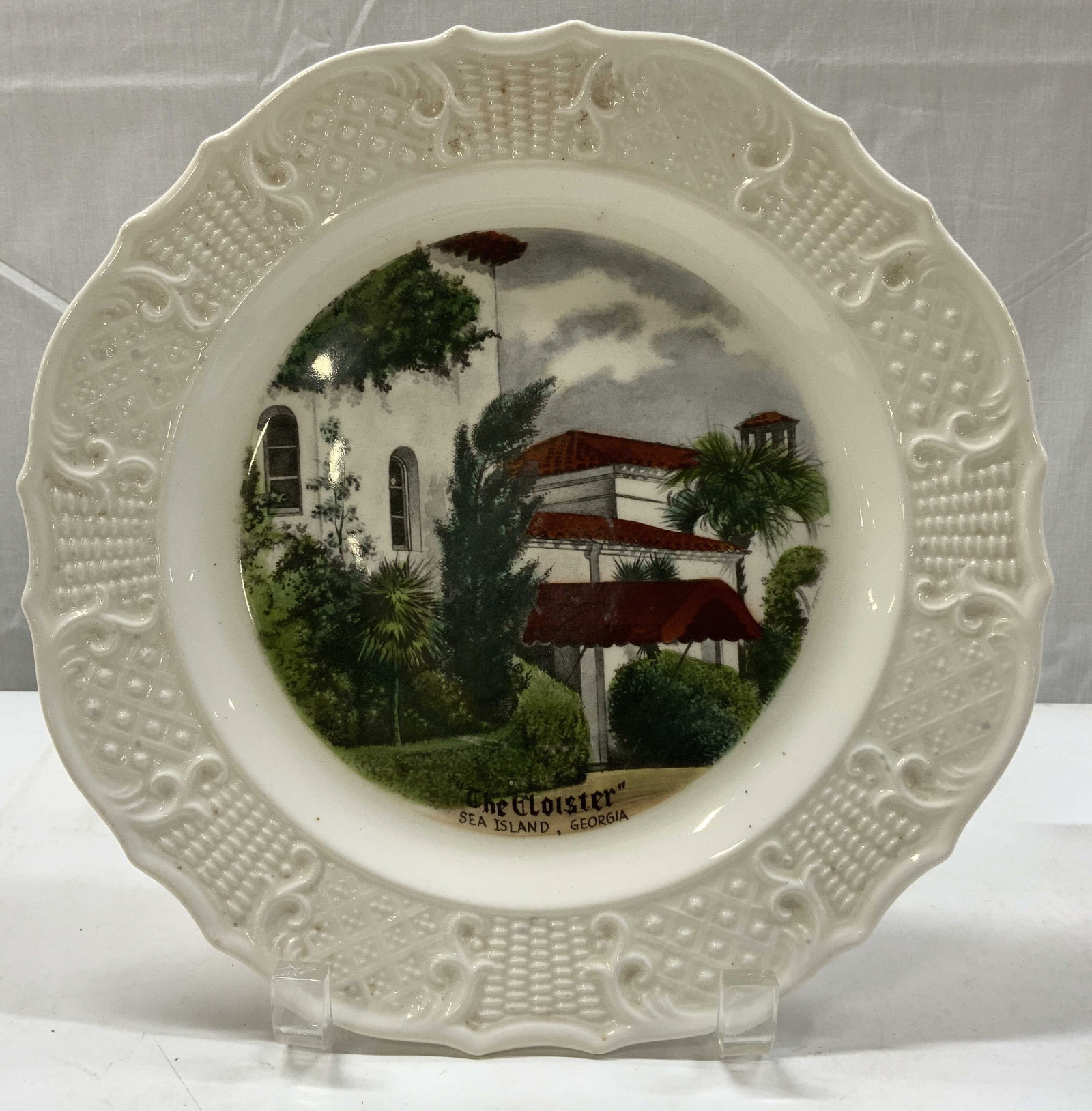 Delano Studios The Cloister Porc Decorative Plate: Delano Studios The Cloister Porc Decorative Plate Plate has an image depicting The Cloister, a historic resort located on Sea Island, Georgia. Plate has a ruffled & textured border which is hand-paint
