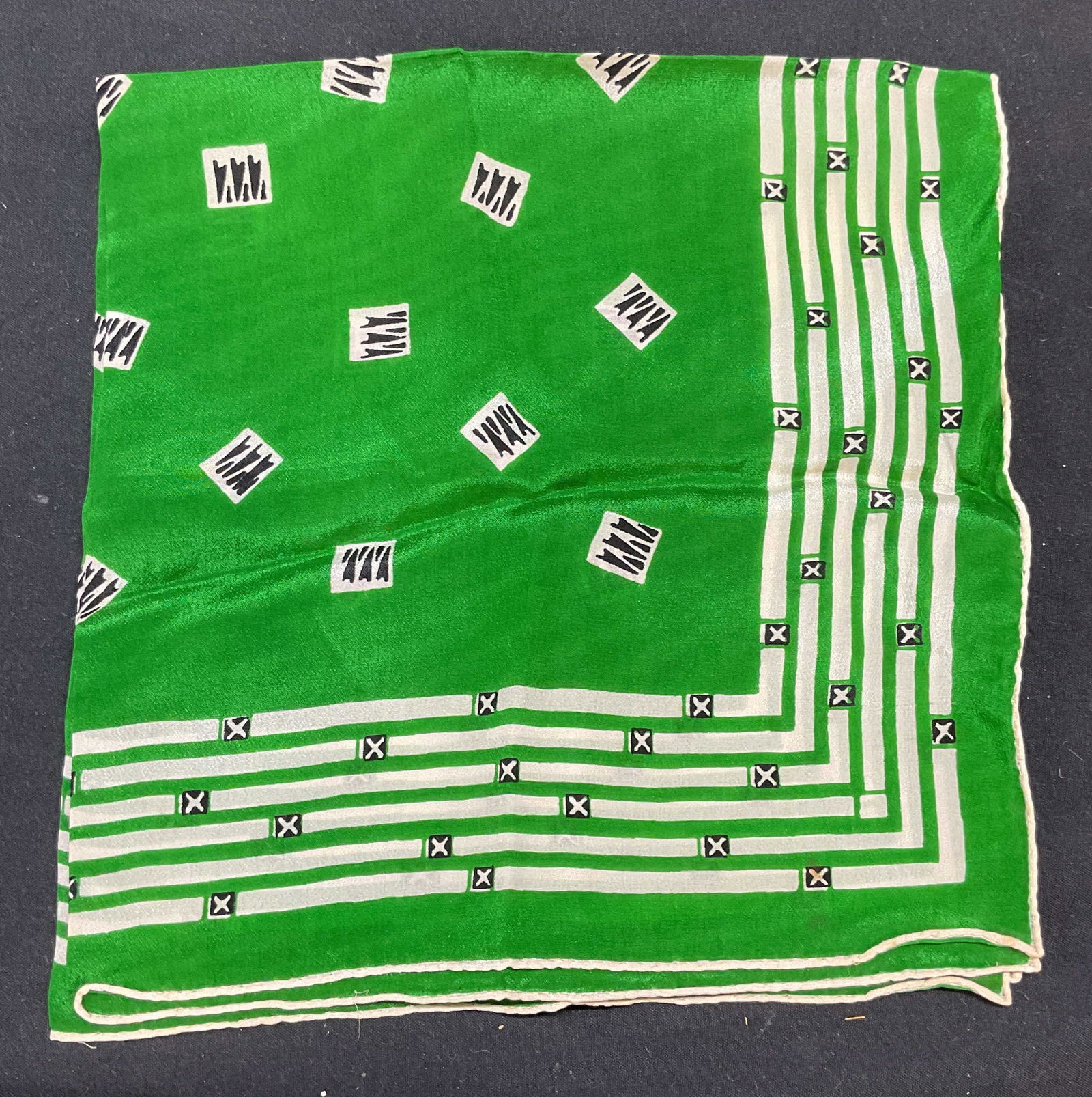 Vintage green White Graphic Print Silk Scarf: Vintage green and white silk scarf with graphic print. Measures approx 16 x 16 inches. Some wear to material consistent with exposure. Silk scarf, vintage scarf, scarf, green scarf, white scarf, acces