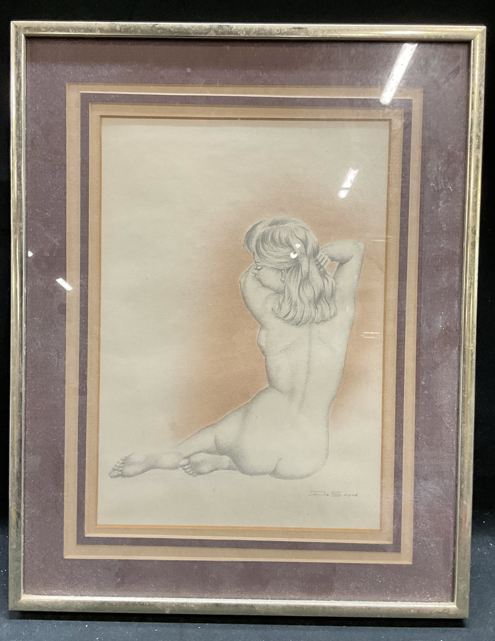 Framed De Simone Female Nude Fine Art Print: Framed and matted fine art print. Artist signature in print at lower right, De Simone. Female nude figure shown from behind in seated pose. Gold tone metal frame, not examined out of frame. Frame meas