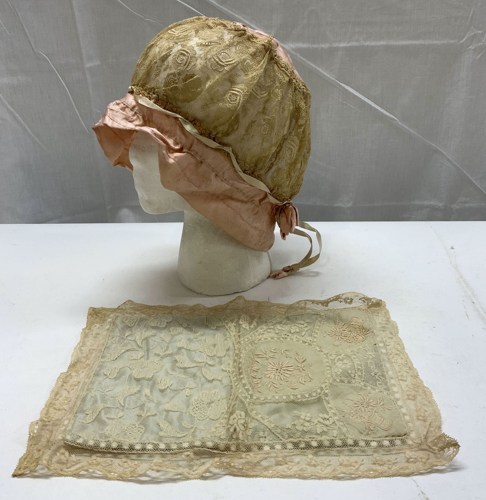 Vntg Pink Crochet Womens Bonnet & Pillow Sham: Vntg Pink Crochet Womens Bonnet & Pillow Sham Lot includes an embroidered pink crochet womens bonnet & embroidered pillow sham. Possible silk or satin. Surface wear consistent to age, use & exposure.