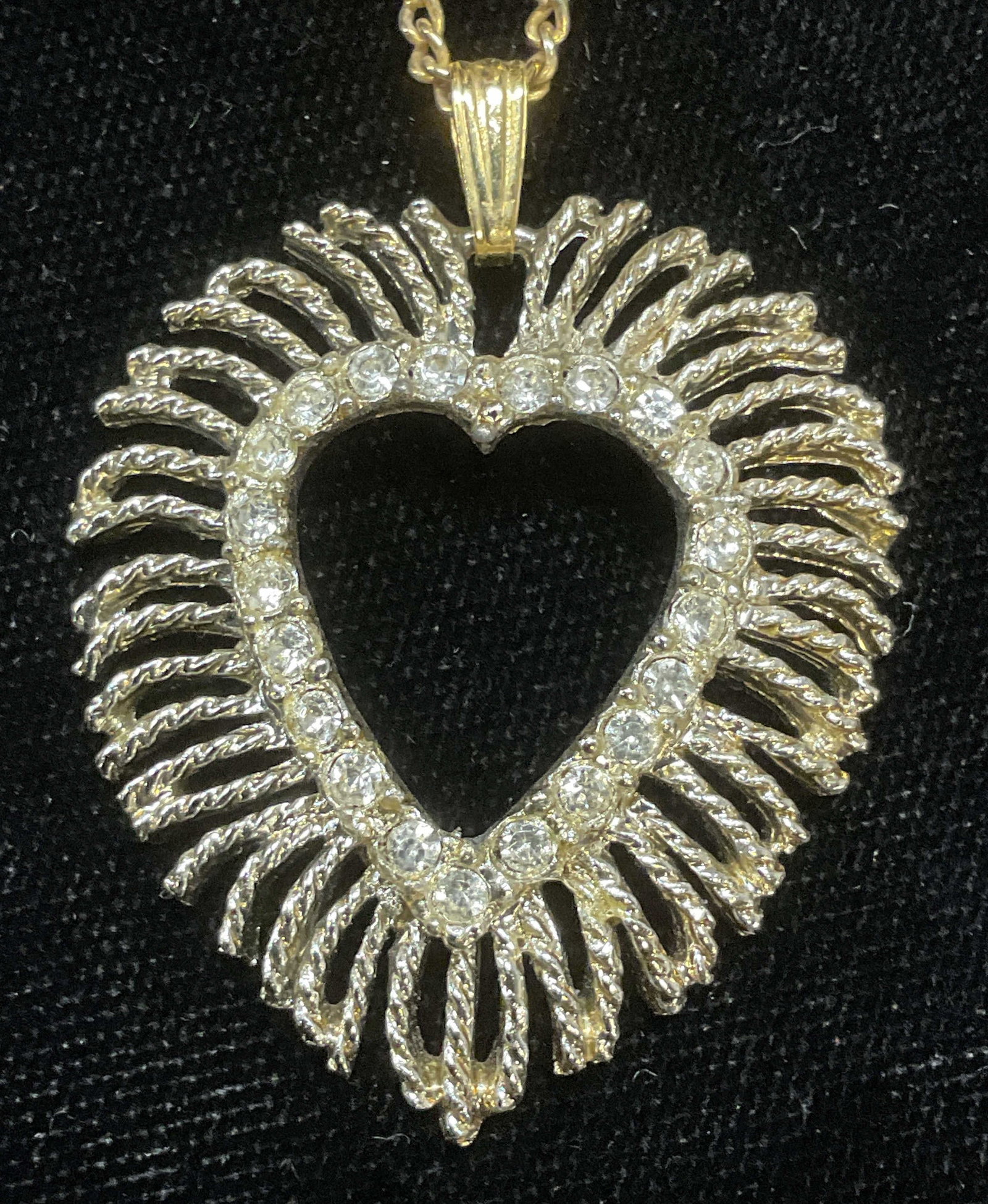 Silver Tone Crystal Heart Pendant Necklace: Silver tone Crystal heart pendant on gold tone chain. Drop length approx 8.75 inches. Pendant approx 1.5 x 1.25 inches. Some wear including scratching observed. Jewelry, estate jewelry, costume jewelr