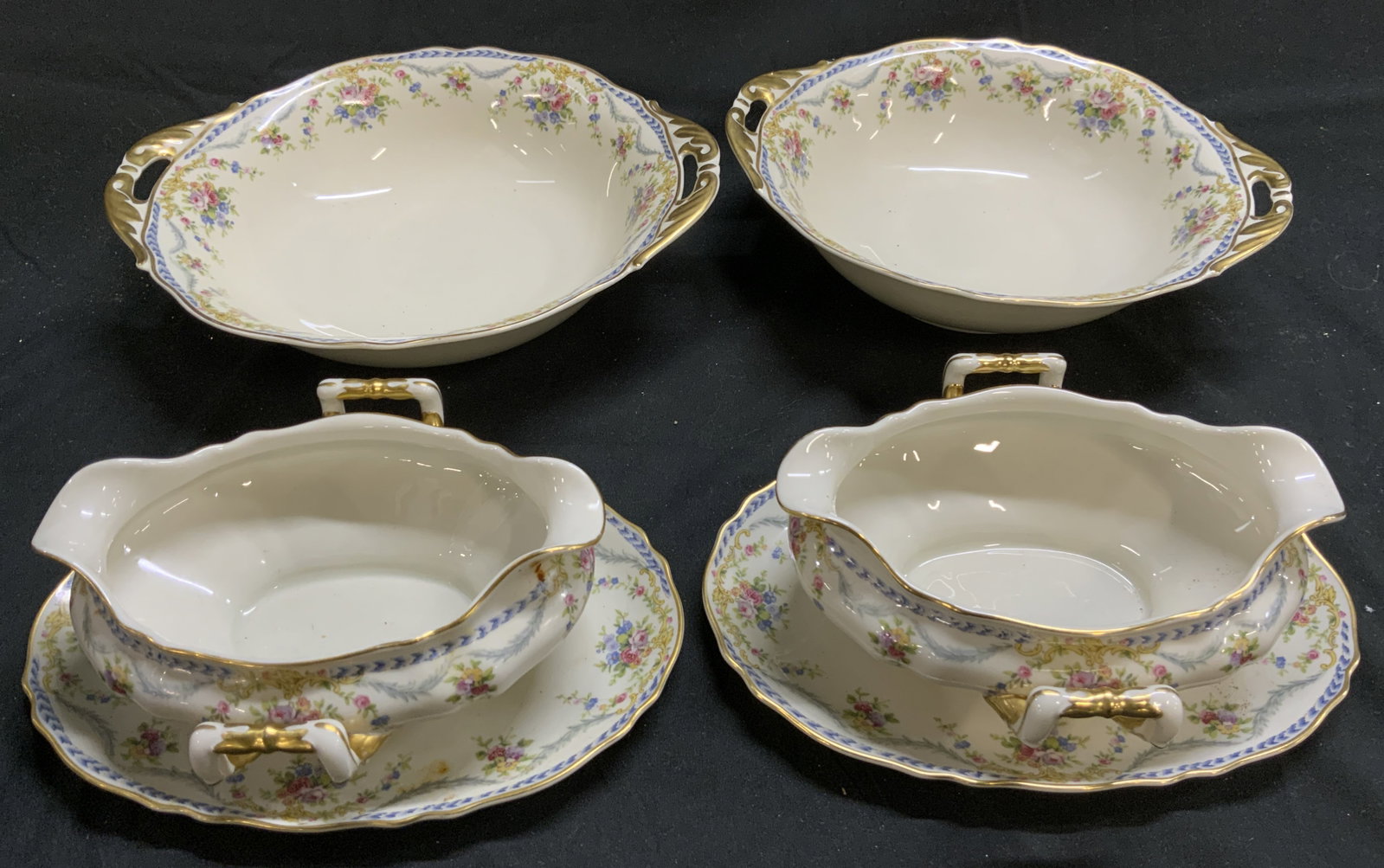 4 Krautheim Leonora Gravy Boats & Bowls GERMANY: 4 Krautheim Leonora Gravy Boats & Bowls GERMANY 2 round vegetables bowls & 2 gravy boats with an under plate attached. Pieces feature a floral rim with blue & gray Laurel accents. Including a gold tri