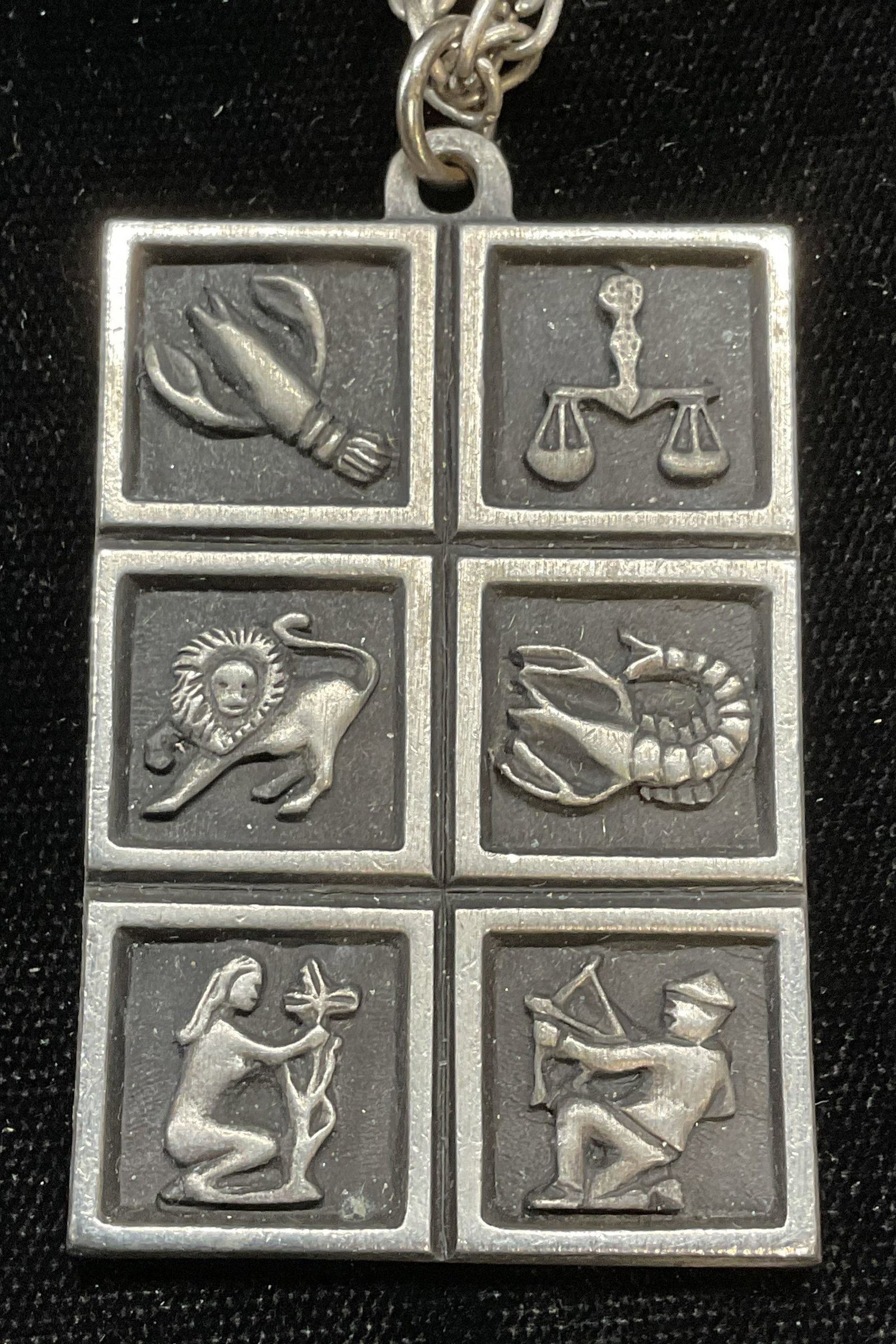 Vintage Silver Tone Zodiac Pendant Necklace: Vintage silver tone pendant with double sided zodiac symbol motif pendant. Drop length approx 11.5 inches. Some wear including scratching observed. Jewelry, estate jewelry, costume jewelry, cocktail j