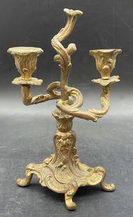 Vintage Gilt Metal Candlestick: Vintage Gilt Metal Candlestick. Scrolled feet and raised metalwork designs to the piece. Measures approx. 9H x 5W in. Losses, loose pieces, discoloration, and surface wear present. Rough metal to the