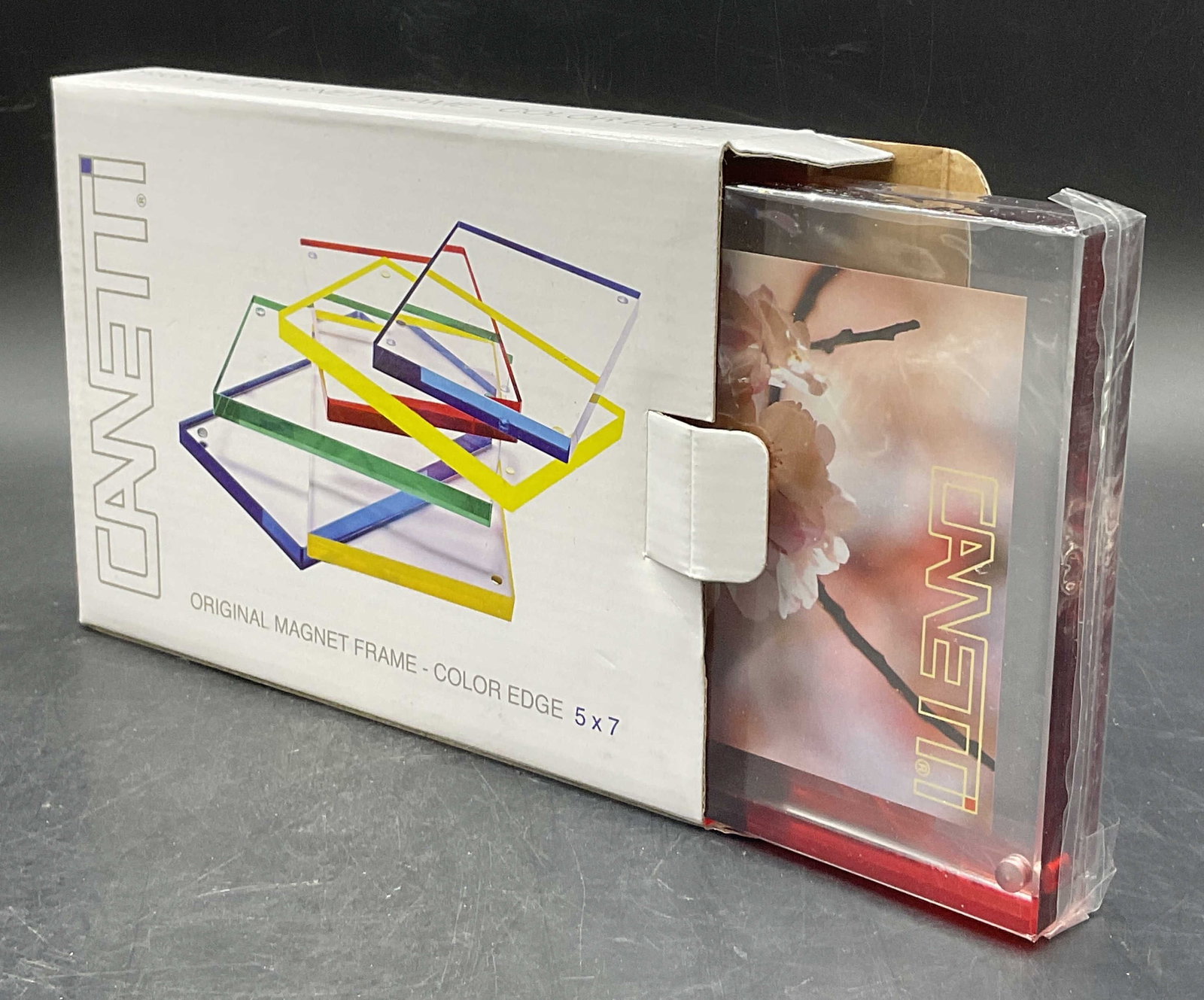 2012 CANETTI NIB Red Edged Magnet Frame: New in Box 2012 CANETTI Red Edged Magnet Frame. The frame is crafted from a clear acrylic material and has a red edge. Not examined out of packaging. The box measures approx. 1.25H x 7.5W in. Losses t