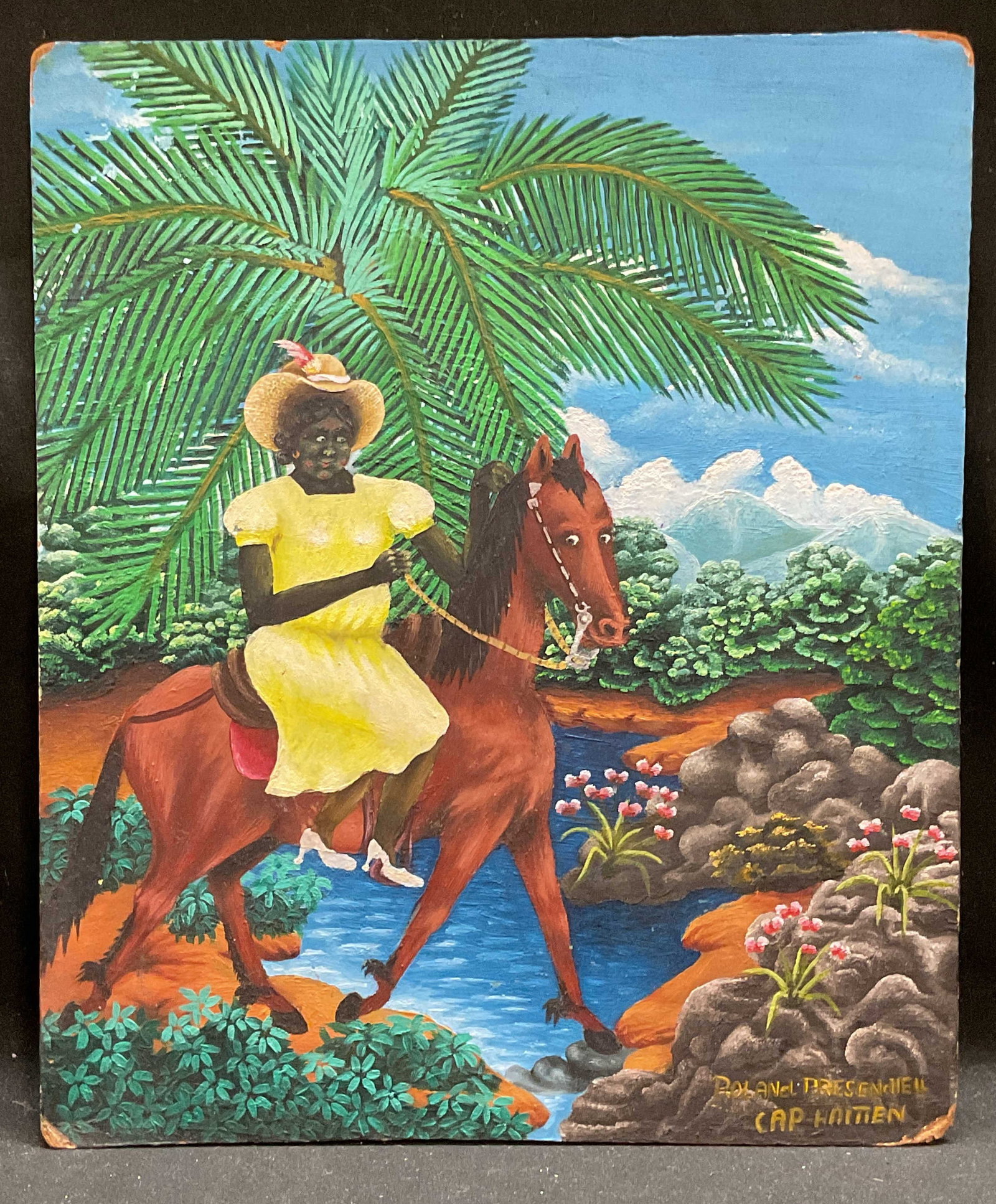 Signed Presendiell Haitian Horse Riding Painting: Oil on board painting. Signed Roland Presendiell at lower right. Haitian scene. Woman riding a horse with tropical landscape. Board measures approx 12 x 10 inches. Some wear including loss to paint on