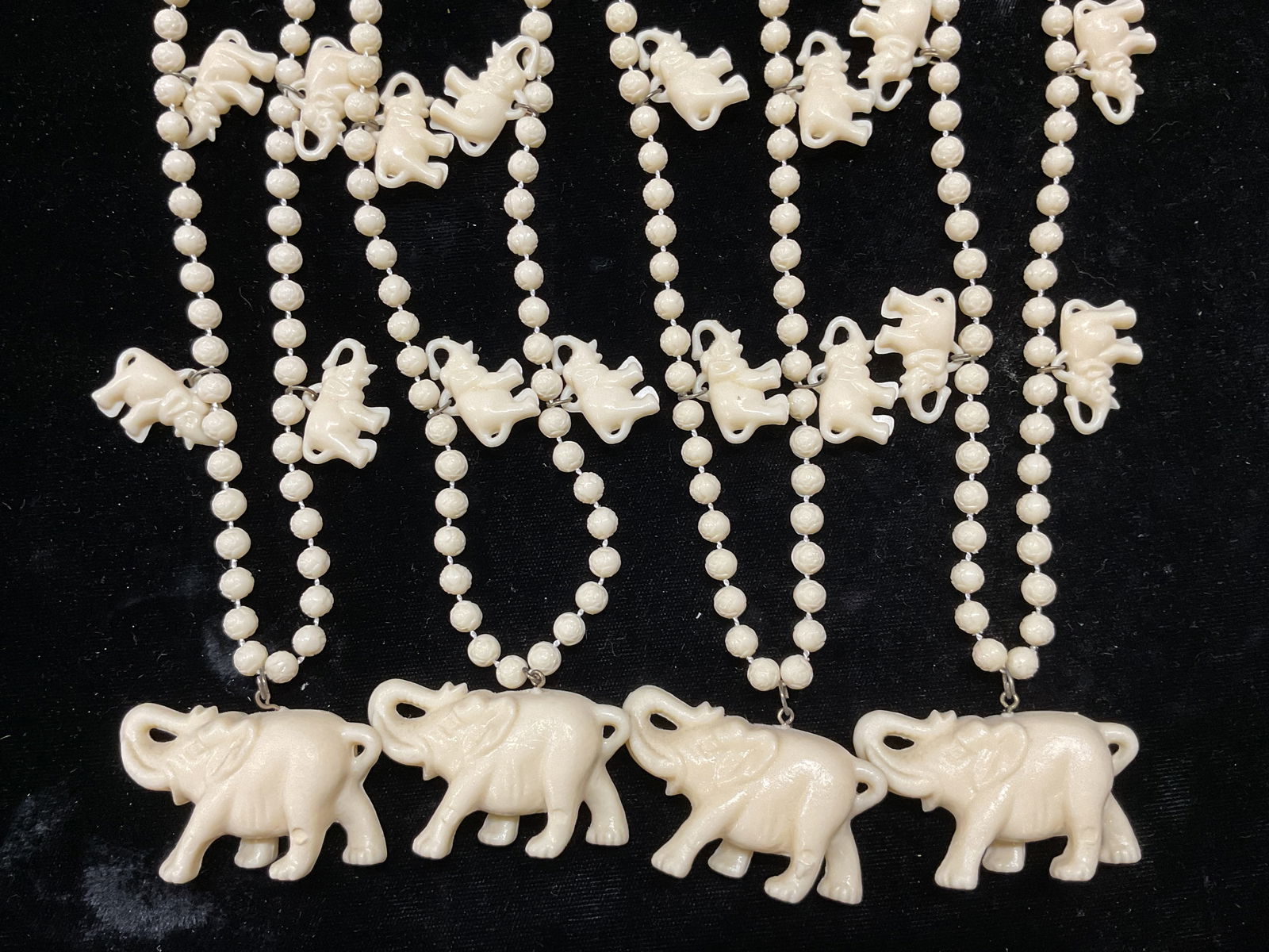 Set 4 Vtg White Faux Bone Elephant Necklaces: Set of 4 matching vintage white faux bone beaded elephant pendant necklaces. Drop length approx 12 inches. Some wear including scratching observed. Jewelry, estate jewelry, fine jewelry, cocktail jewe