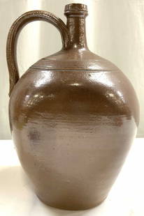 Atq Hand Made Ceramic Stoneware Jug Vessel Brown: Jug appears to be handmade. Piece is brown toned ceramic stoneware. Vessel appears to be antique possibly vintage. Jug has handle and narrow mouth. Piece measures approximately 11.5 inches tall 7.5 in