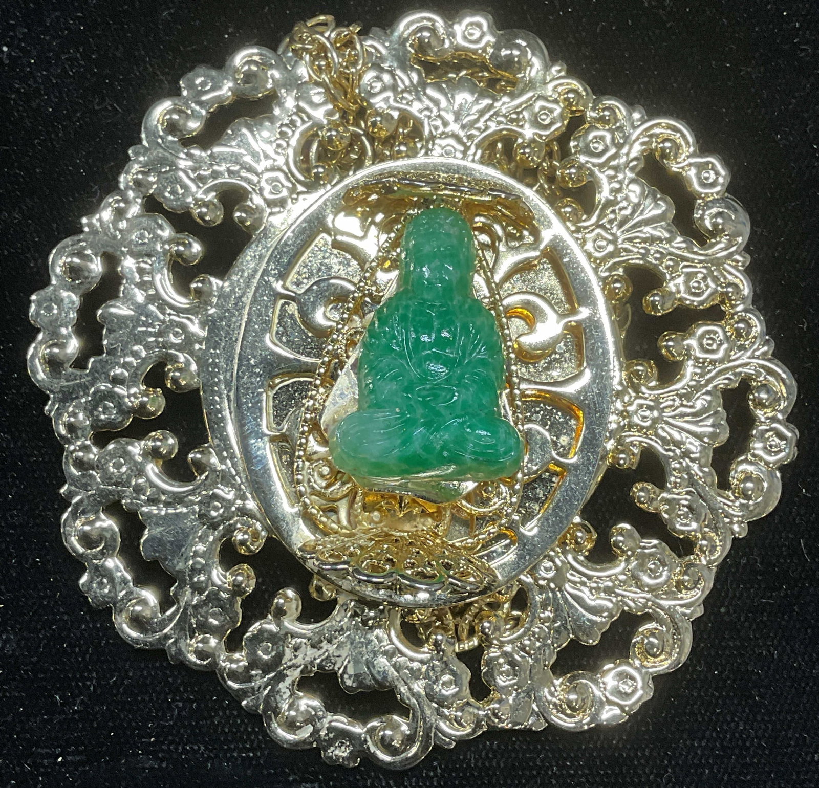 Gold Tone Faux Jade Buddha Brooch 3 In: Gold tone brooch with faux jade Buddha figural. Measures approx 3 inches wide. Chain attached, needs untangling. Some wear including scratching. Jewelry, estate jewelry, costume jewelry, cocktail jewe