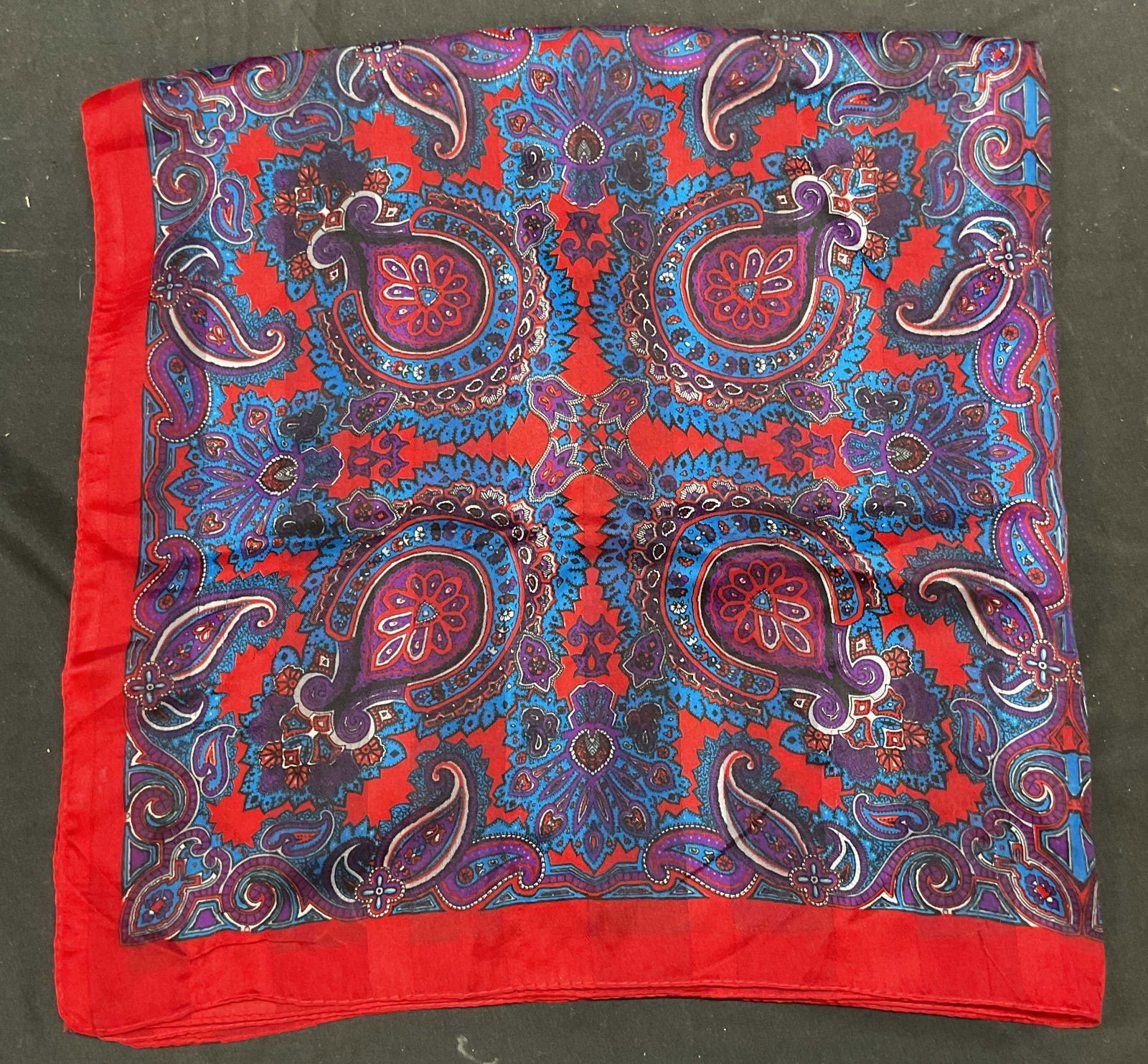 Blue & Red Paisley Floral Print Silk Scarf: Blue, red, and purple paisley floral print scarf. Feels like silk. Measures approx 30 x 30 inches. Some wear including pulling and blemishes. Scarf, silk scarf, blue scarf, red scarf, floral scarf, pa