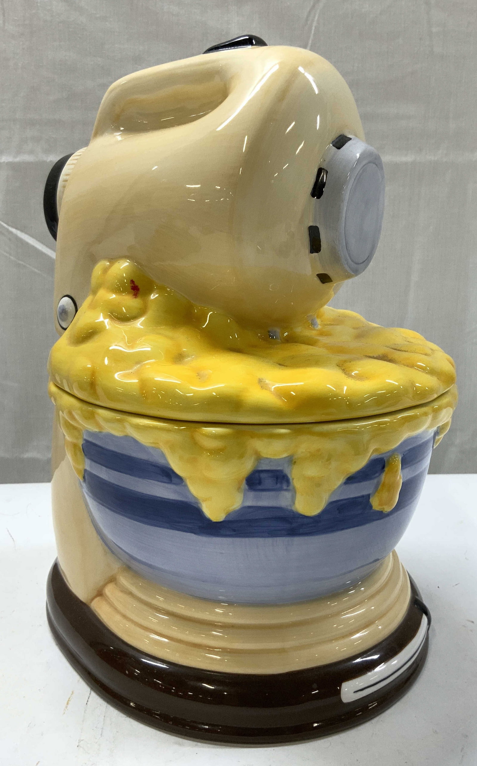 TREASURECRAFT Kitchen Stand Mixer Cookie Jar: TREASURECRAFT Kitchen Stand Mixer Cookie Jar Cookie jar depicting a cream-colored mixer with a blue-striped bowl & brown base. Signed & marked on underside. READS TREASURECRAFT. Surface wear consisten