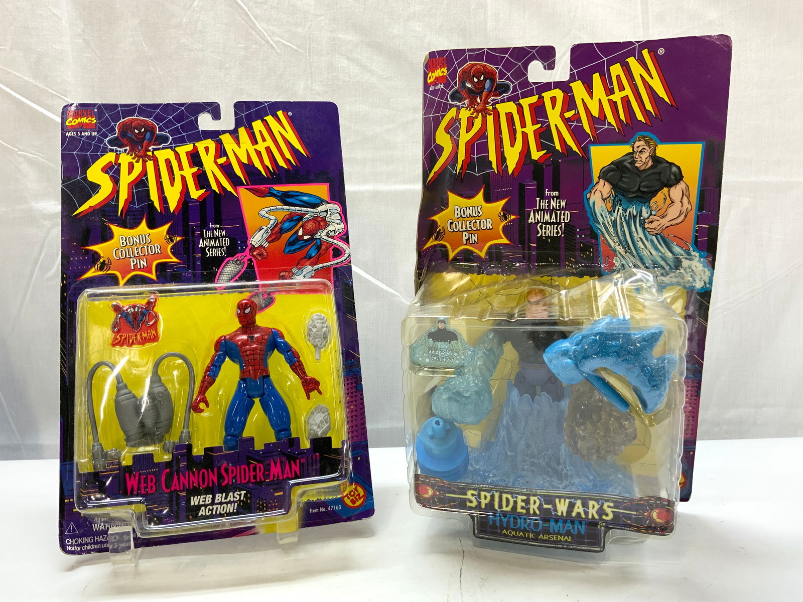 Lot 2+ 1990s MARVEL Spider-Man Action Figures NIP: Lot 2+ 1990s MARVEL Spider-Man Action Figures NIP 2 NEW IN PLASTIC action figures. Figures depicting Web Cannon Spider-Man & Spider-Wars Hydro-Man. Released in 1995 & 1996. Surface wear consistent to