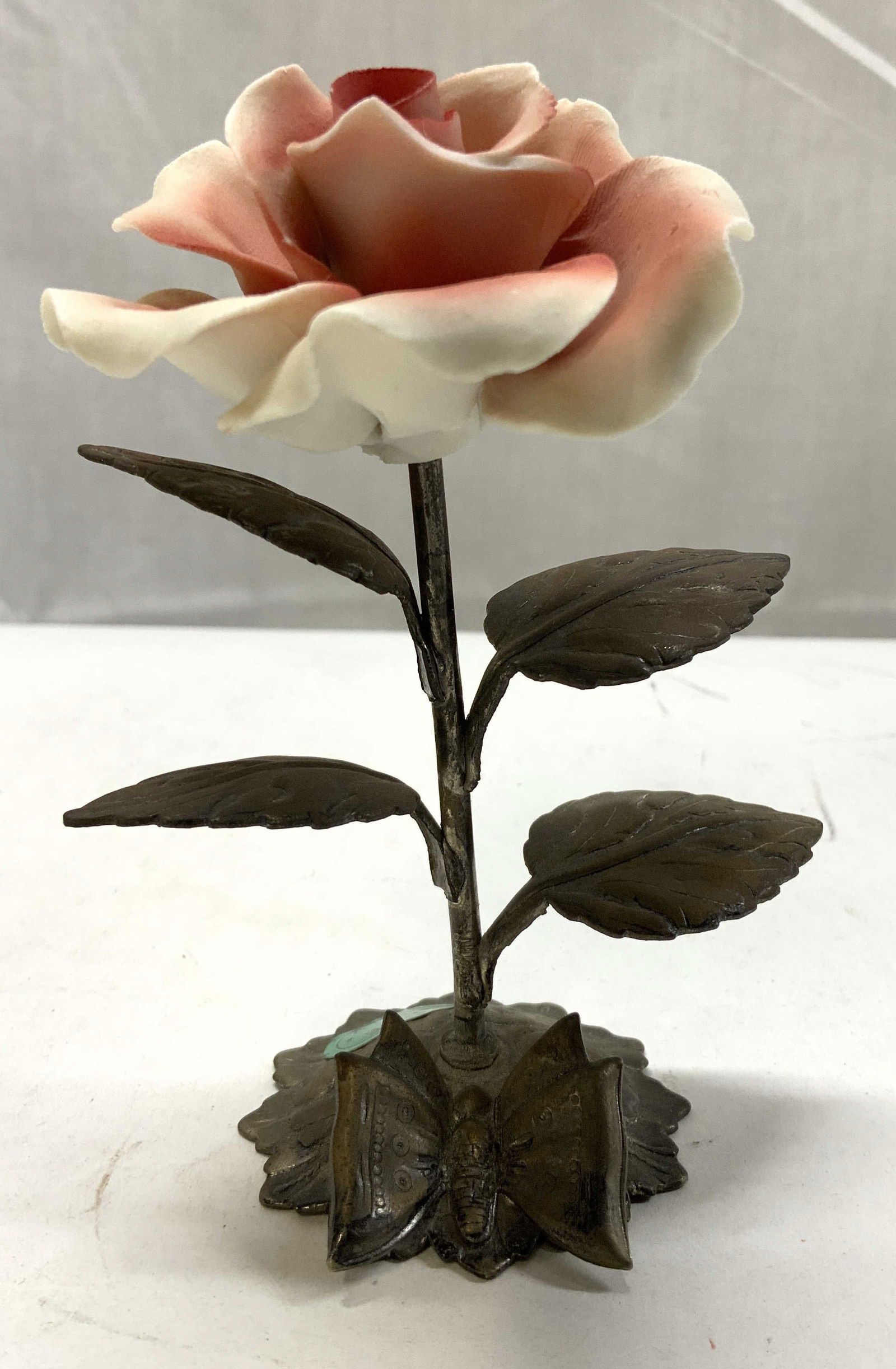 SIGNED Capodimonte Porcelain Pink Rose ITALY: SIGNED Capodimonte Porcelain Pink Rose ITALY Porcelain rose featuring a pink & white rose on a dark metal stem with leaves. Base appears to be possible bronze or brass. Underside reads ARGENT 1000. Su