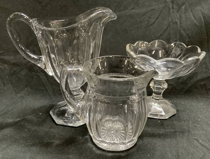 Lot 3 Assorted Art Glass Vessels Heisey & More: 2 marked with H hallmark in triangle, appear to be Heisey. Lot includes 1 pedestaled pitcher, 1 pedestaled candy dish & 1 scalloped pitcher. Each pedestaled dish has octagonal form bases. Candy has ro