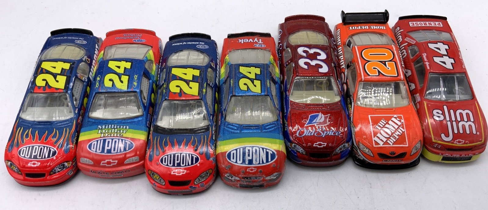 Lot 7+1990-2000s Assorted Collectible Cars RACING+: Lot 7+1990-2000s Assorted Collectible Cars RACING+7 race cars featuring multiple sponser prints.p including Home Depot, Old Spice, DuPont and more. Metal and plastic. Marked on underside. Reads MONTE 