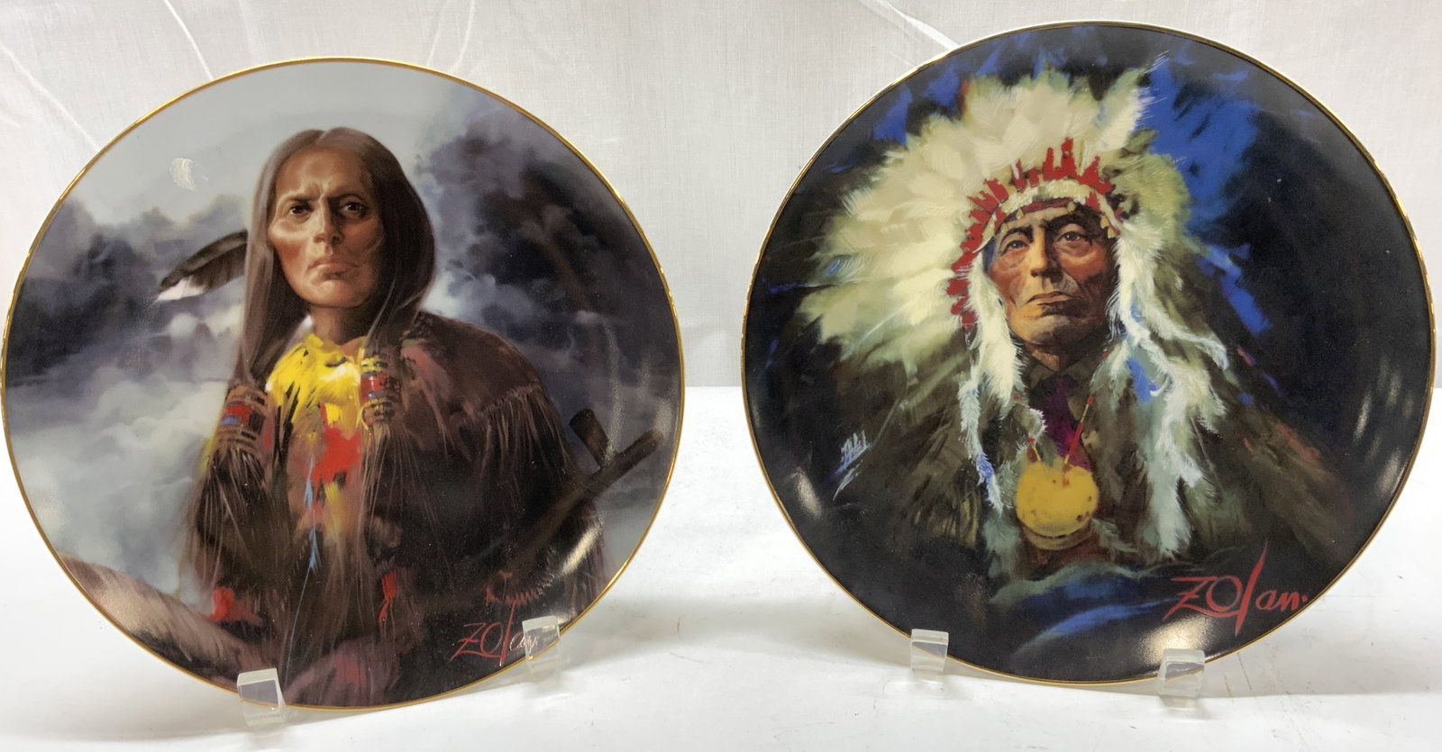 Lot 2+ 1980s NOBLE TRIBES Cheyeene & Sioux Plates: Lot 2+ 1980s NOBLE TRIBES Cheyeene & Sioux Plates Porcelain plates depicting portraits of Cheyeene & Sioux. Plates are round & have a gold trim. Signed & marked on underside. Reads CHEYENNE & SIOUX by