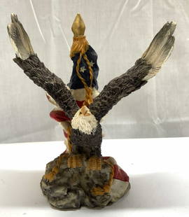 Patriotic American Bald Eagle W Flag Figurine: Patriotic American Bald Eagle W Flag Figurine Appears to be composite material.Figurine of a bald eagle with outstretched wings, perched on a base. Surface wear consistent to age, use & exposure, chip