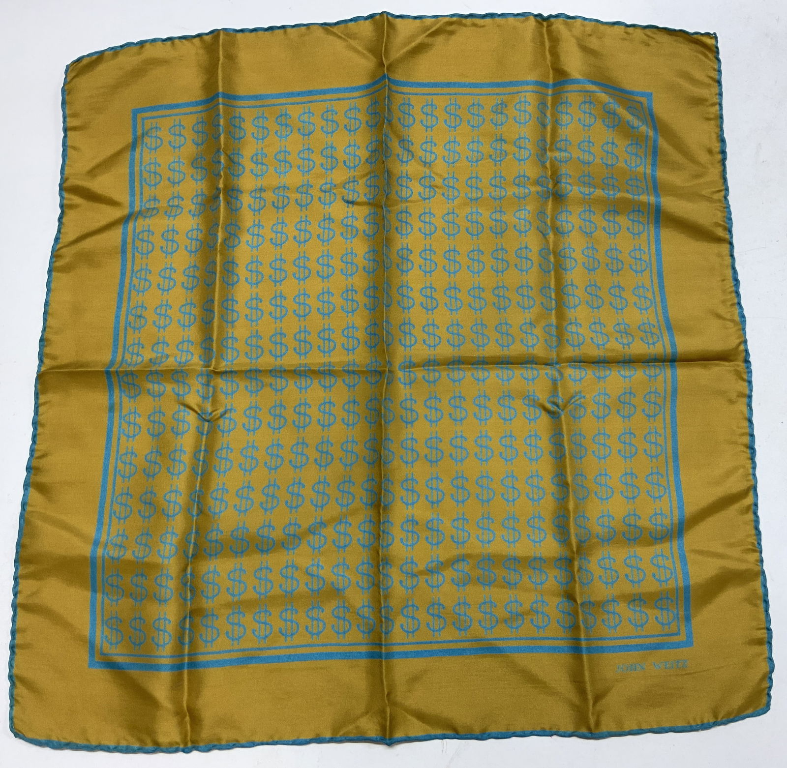 JOHN WEITZ Golden Dollar Motif Silk Print Scarf: JOHN WEITZ Golden Dollar Motif Silk Print Scarf Silk scarf features a repeating pattern of teal blue dollar signs. Scarf has a golden color border. Signed & marked on bottom right. Reads JOHN WEITZ. S