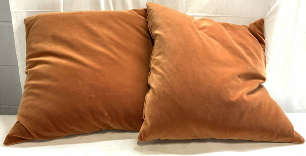 Pr Burnt Sienna Velvet Throw Pillows: Lot includes 2 pillows. Each are burnt sienna toned. Pillows are each upholstered in velvet. Each pillow measures approximately 24 inches square 5 inches deep. Pillows, pair of pillows, throw pillows,