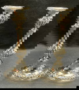 Pair GM Co Silver Plated Candle Holders: Pair of GM Co silver plated candle holders with embossed raised detail. Pieces have weight. Trademarked to undersides. Measure approx. 5 x 3.5 x 9.25 inches each. Both pieces have some surface wear in