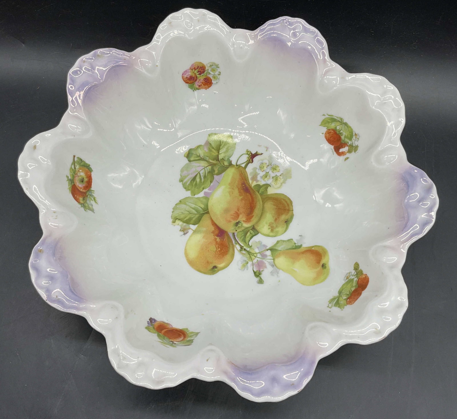 Vintage Bavarian Porcelain Fruit Motif Bowl: Vintage Bavarian Porcelain Fruit Motif Bowl. Underside reads Made in Bavaria. Scalloped rim. Decorated with fruits and foliage. Measures approx. 3H x 10.25W in. Discoloration, chipping, losses to fini