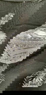 Vntg Cut Crystal Pedestaled Candy Dish W Lid: Candy dish is vintage. Piece is cut crystal. Dish has intricately cut geometric relief detail. Piece includes lid. Base has Hexagonal form. Measures approximately 12.5 inches tall 6 inches wide. Candy