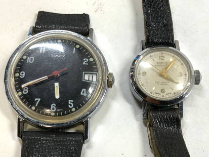 Lot 2 Oris Watch & TIMEX Watchface: Lot includes 1 Oris trademarked watch & 1 TIMEX trademarked watch face. Watch has black toned wristband, face of watch is white with gold toned hands. TIMEX face is black with white toned numbers and