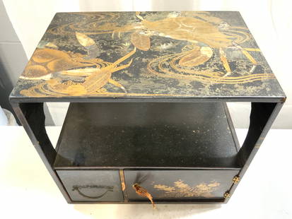 Salesman Smpl Asian Blk Lacquered Tbl W Cabinet: Salesman sample size Asian black lacquered table. Appears to be vintage. Piece has drawer and cabinet. Piece has gilt vine and leaf & mother of Pearl detail. Measures approximately 14 inches wide 13.5