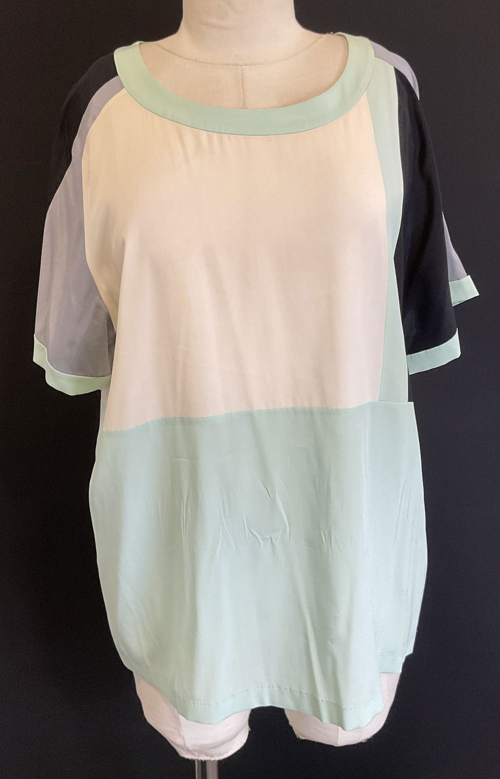 DKNY Green Black Color Block Silk Top: DKNY color block short sleeve silk blend top in green, white, black and grey. Size medium. Some wear including blemishes. DKNY top, designer top, designer fashion, silk top, color block top, green top