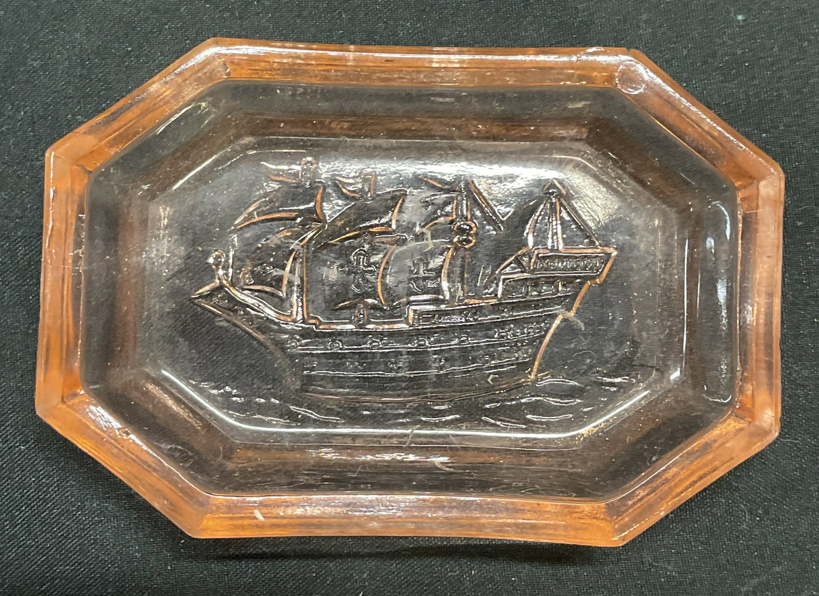 Vtg Pink Depression Glass Ship Trinket Dish: Vintage pink depression glass trinket dish with ship motif. Measures approx 3.25 x 2.25 inches. Some scratching observed. Ship trinket dish, trinket dish, depression glass trinket dish, pink trinket d