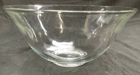 Art Glass Tabletop Centerpiece Bowl Vessel: Bowl is glass. Centerpiece art glass bowl with rim which leans slightly outward. Underside has small foot. Possibly vintage. Vessel measures approximately 10.25 inches wide 4.75 inches tall. Bowl, ves