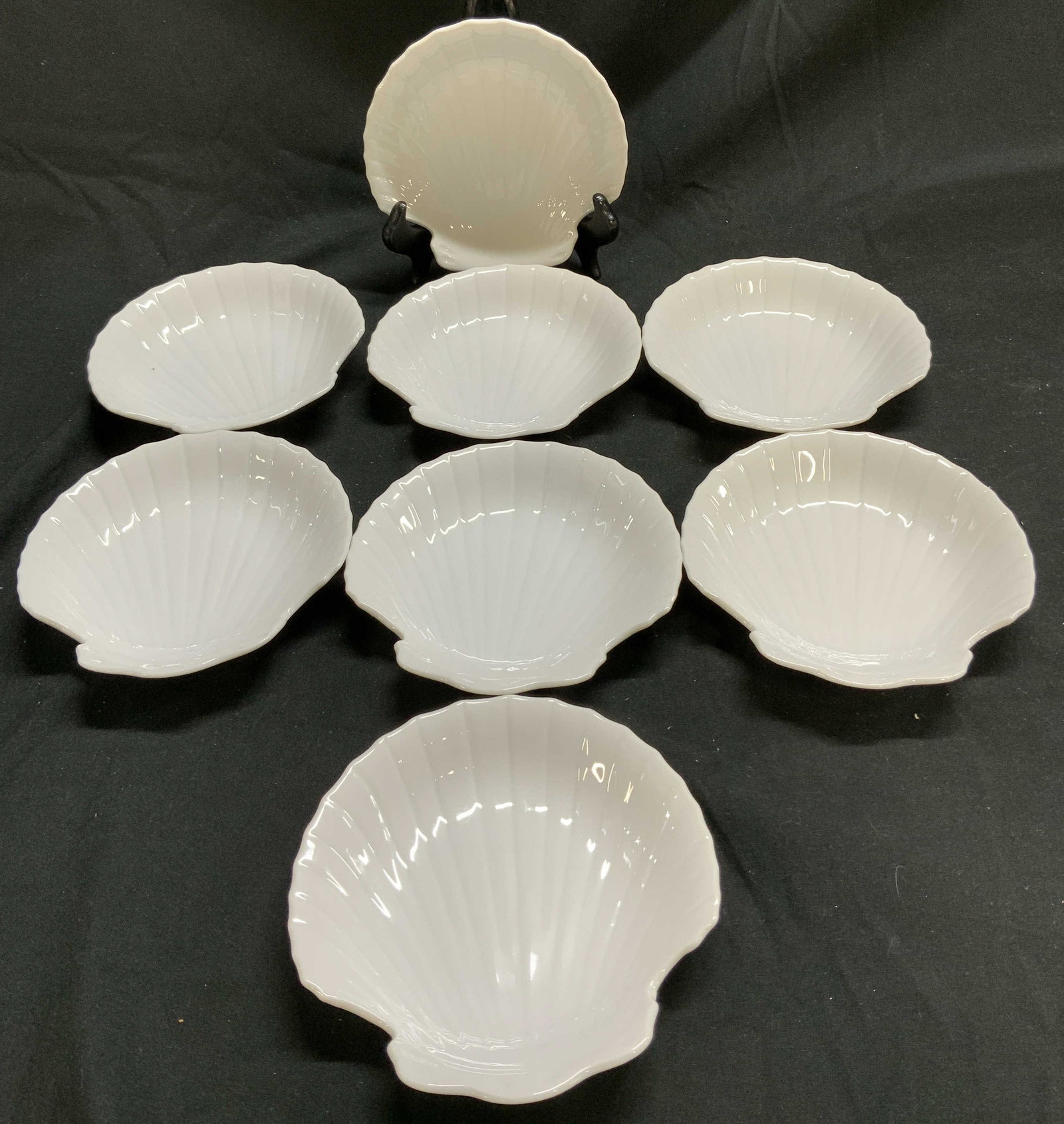 Lot 8+ Scallop Shell Porc Dish LORD&TAYLOR JAPAN: Porcelain dish features a distinctive scallop shell shape & a glossy white glaze. Underside is signed & marked. Reads MADE IN JAPAN, EXPRESSLY FOR LORD & TAYLOR. Surface wear consistent to age, use & 