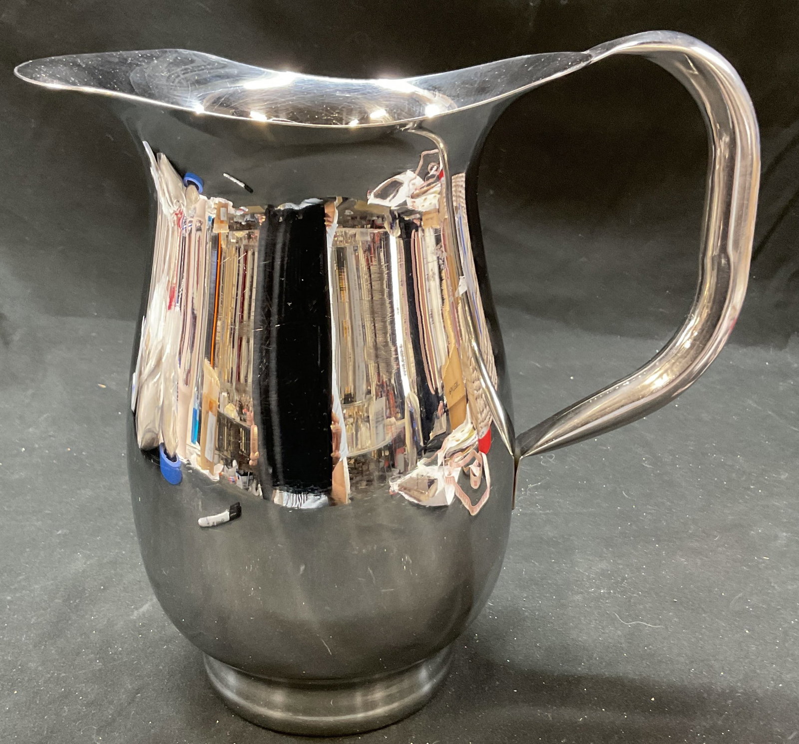 Vtg Stainless Steel Pitcher with Ice Dam: Vintage stainless steel pitcher with ice dam. Rounded square handle. 9 x 8.5 x 5 inches. Some surface wear consistent with exposure. Stainless steel pitcher, ice dam pitcher, water pitcher, wine pitch