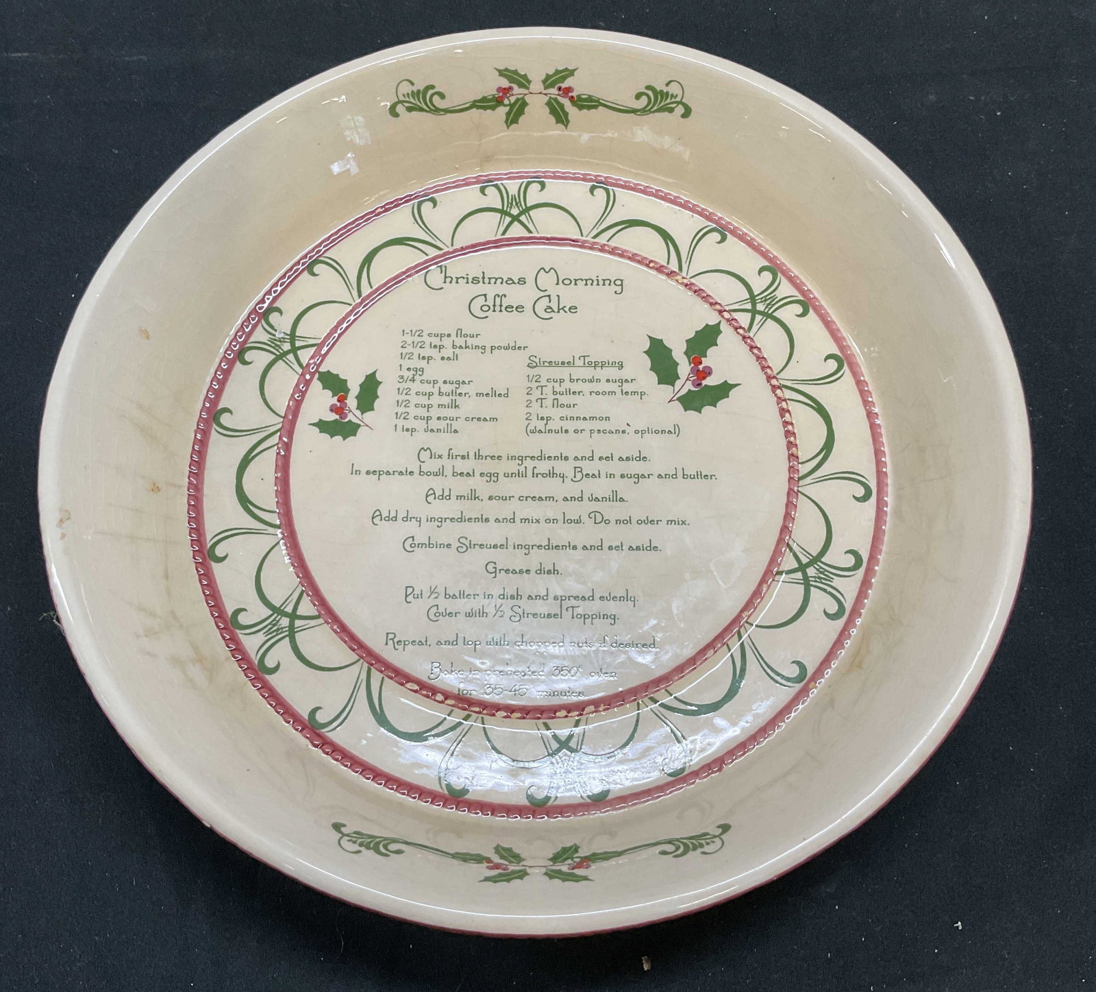Sgn Christmas Cake Ceramic Recipe Baking Dish: Ceramic recipe baking dish. Christmas Morning Coffee Cake. Marked Isabella Catalog, Chinaberry on underside. Measures approx 9 x 1.75 inches. Crazing and scratching observed. Coffee cake dish, serving
