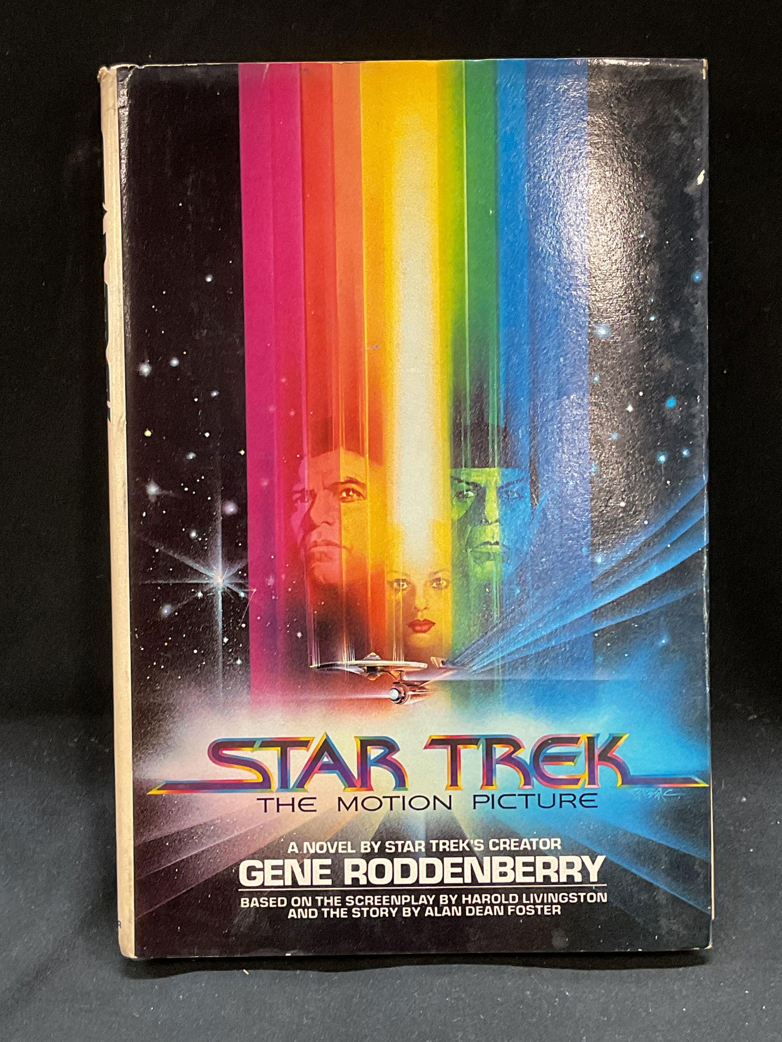 Star Trek, Gene Roddenberry, 1979, Book: Hardcover copy of Star Trek The Motion Picture A Novel by Gene Roddenberry. Simon and Schuster, 1979. Measures approx 8.25 x 5.5 inches. Some wear to cover, pages, and binding consistent with exposure
