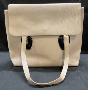 Gucci Off White Leather Handbag, Italy: Gucci handbag. Off white leather with suede lined interior. Interior zippered pocket. Signed on interior. Serial number 002 2123 0451. Made in Italy. Measures approx 12 x 4 x 10 inches. Some wear to m