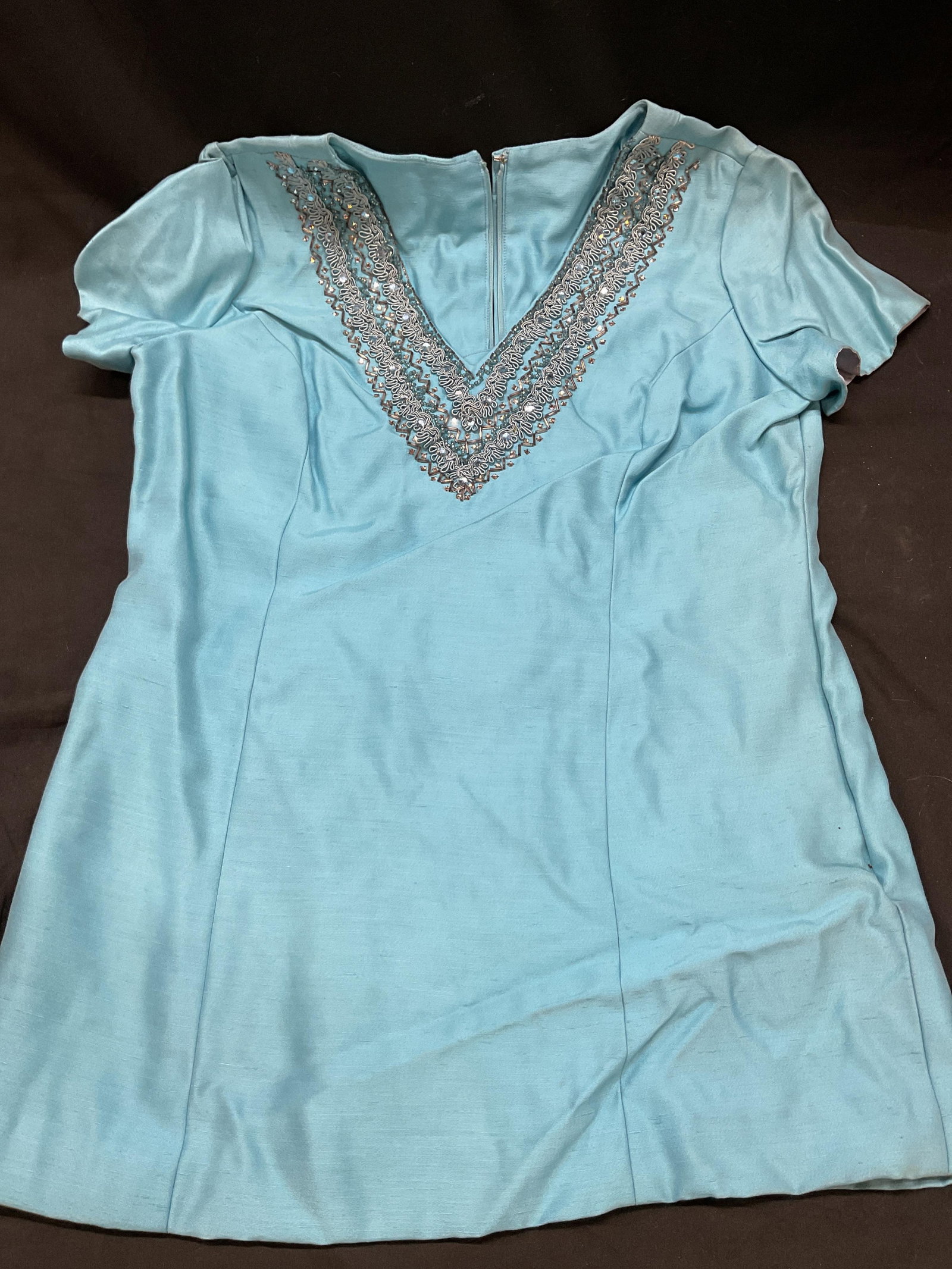Vtg Aqua Blue Cotton Sequin V Neck Top Dress: Vintage Aqua blue cotton sequin v neck top dress. Aqua blue long t shirt with sequin detail design at collar. Back zipper. 19 inches across chest, 27.5 inches long. Fully lined. Material tag not attac