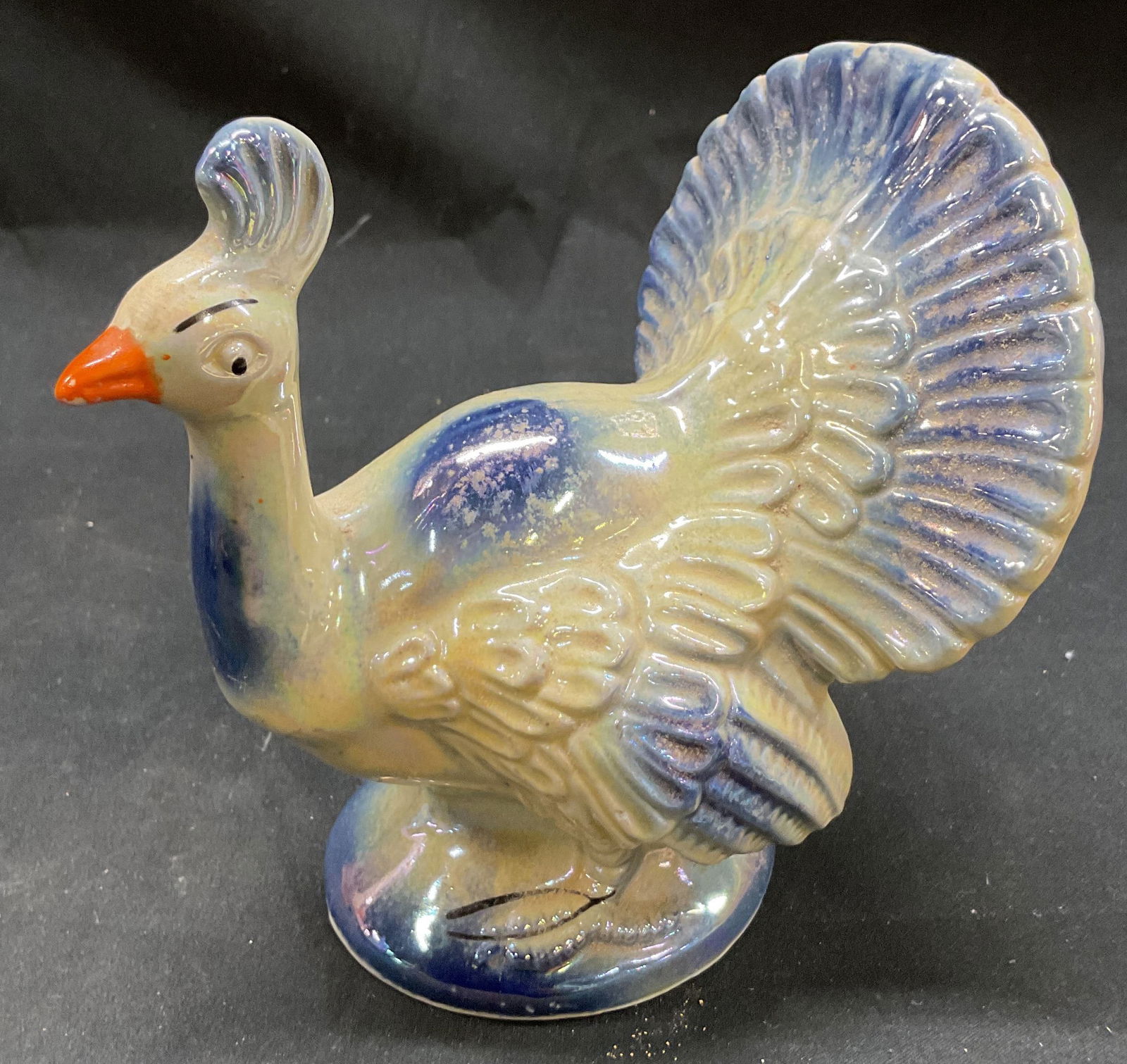 Vtg 1960s Peacock Ceramic Lusterware Figurine: Vintage 1960s peacock ceramic Lusterware figurine. Off white ceramic Lusterware with blue details. Made in Brazil. 5.5 x 4.5 inches. Some surface wear consistent with exposure. Lusterware, ceramic fig