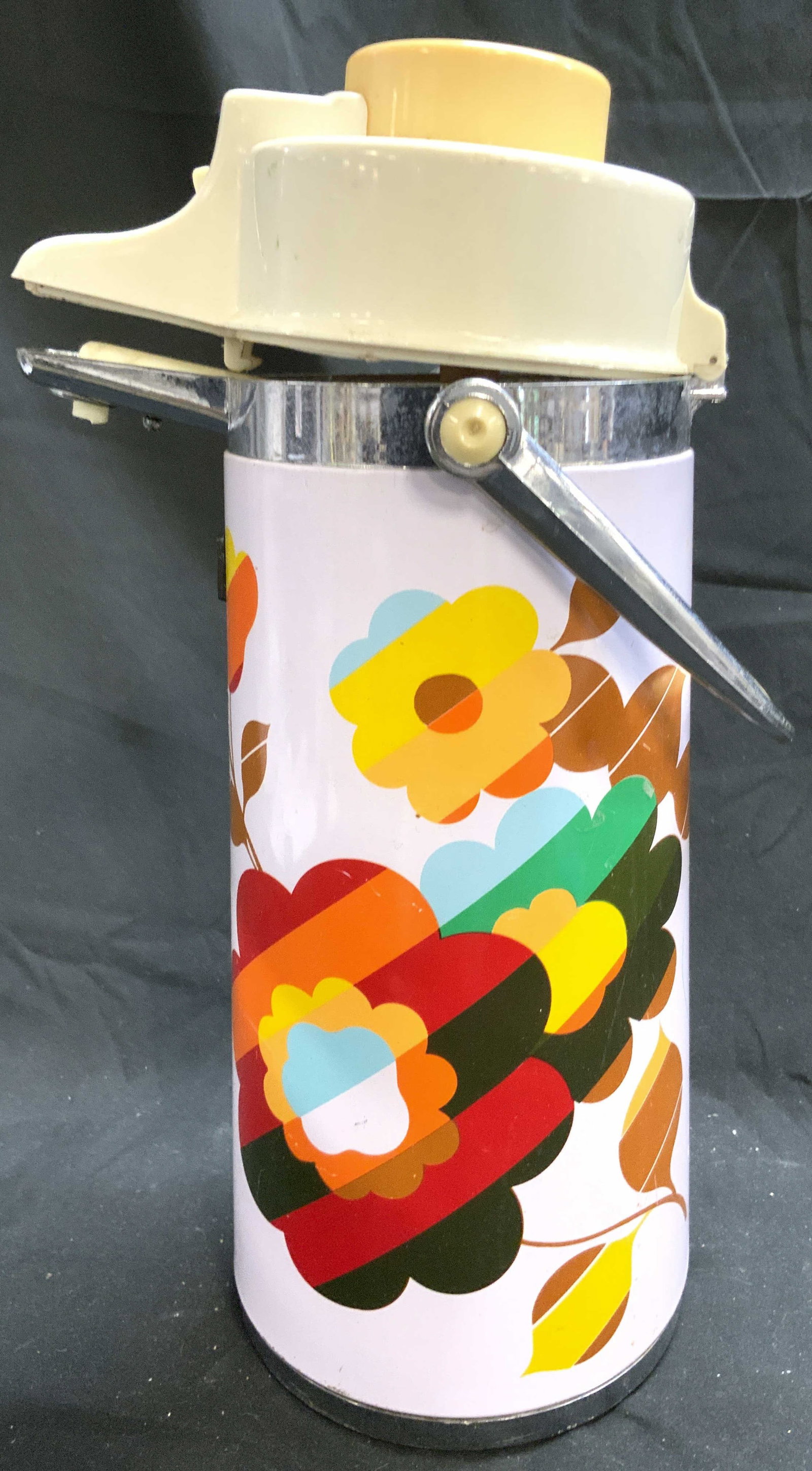 Zojirushi Vntg Air Pot Beverage Dispenser: Dispenser reads AIR POT. Appears to be by ZOJIRUSHI (No additional markings). Beverage dispenser is vintage. Piece is lavender with multi toned floral and leaf detail. Dispenser has silver toned metal