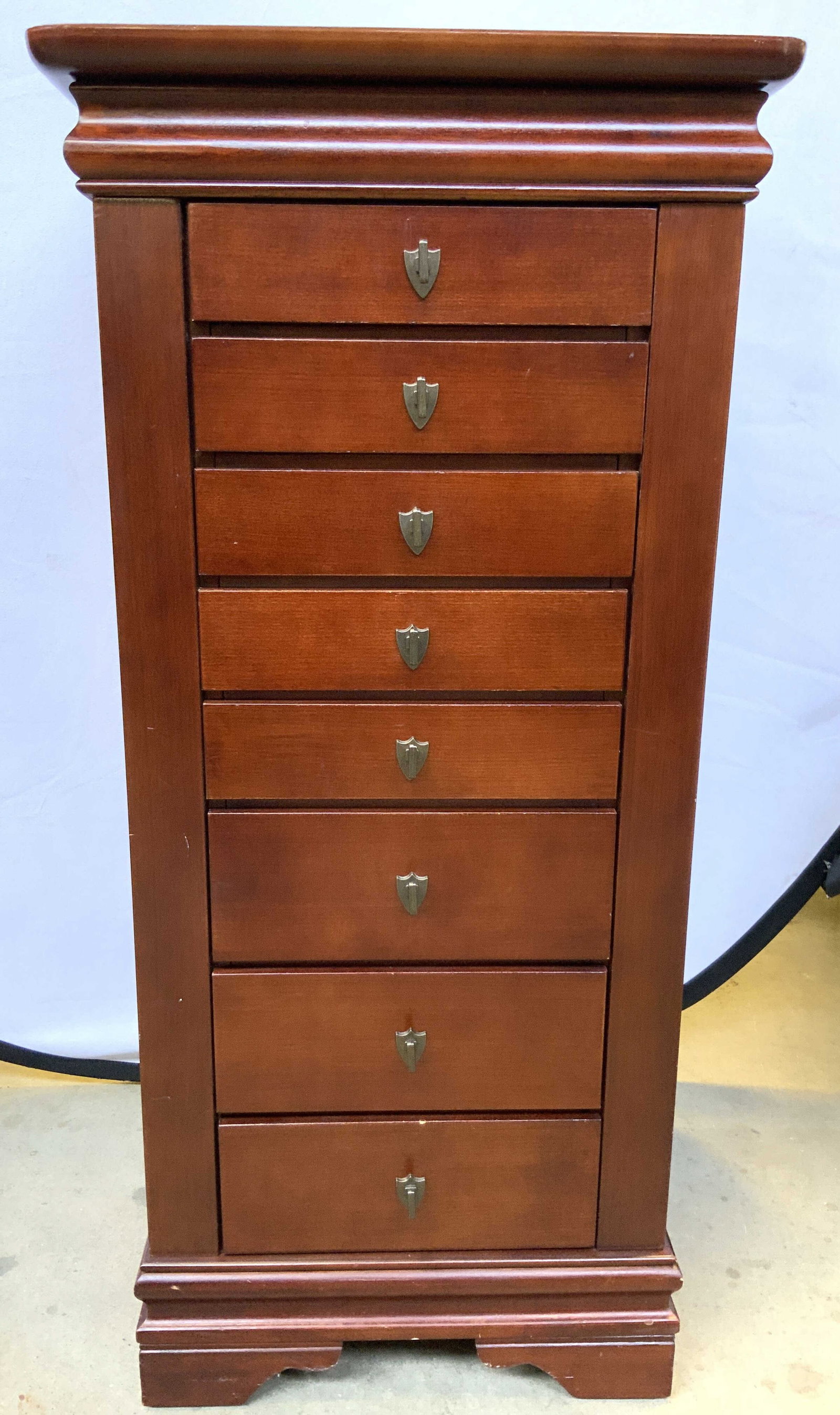 POWELL Vntg Wooden 8 Drawer Jewelry Chest: Tag on backside reads POWELL. Piece is brown toned appears to be wooden. Possibly wood veneer. Chest has 8 drawers. Top of piece opens up to jewelry storing area. Sides of piece open to hooked areas. 